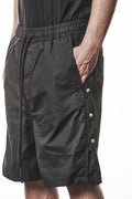 Thom Krom, Mens Shorts, Black, Over the Knee, Elasticated Waistband, Black Drawstring, Cargo Pockets, Side Pockets, Wide-fit, Drop-crotch, Front 3/4 View Hand in Pocket. 