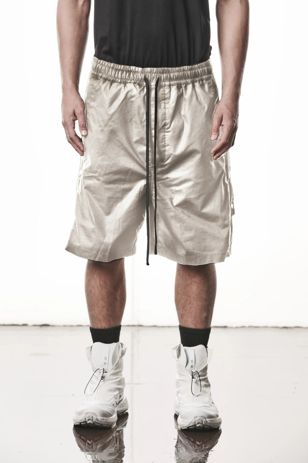 Thom Krom, Mens Shorts, Vegetal Stone, Over the Knee, Beige, Elasticated Waistband, Black Drawstring, Cargo Pockets, Side Pockets, Wide-fit, Drop-crotch, Front View. 