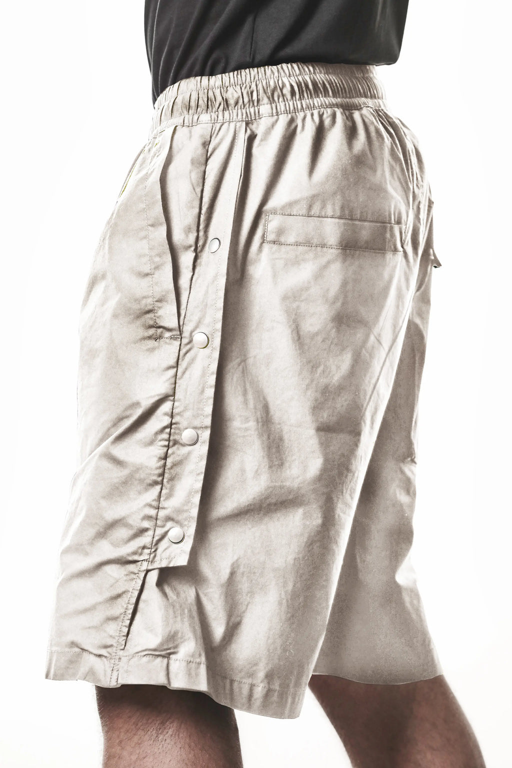 Thom Krom, Mens Shorts, Vegetal Stone, Over the Knee, Beige, Elasticated Waistband, Black Drawstring, Cargo Pockets, Side Pockets, Wide-fit, Drop-crotch, Close-up Side View. 