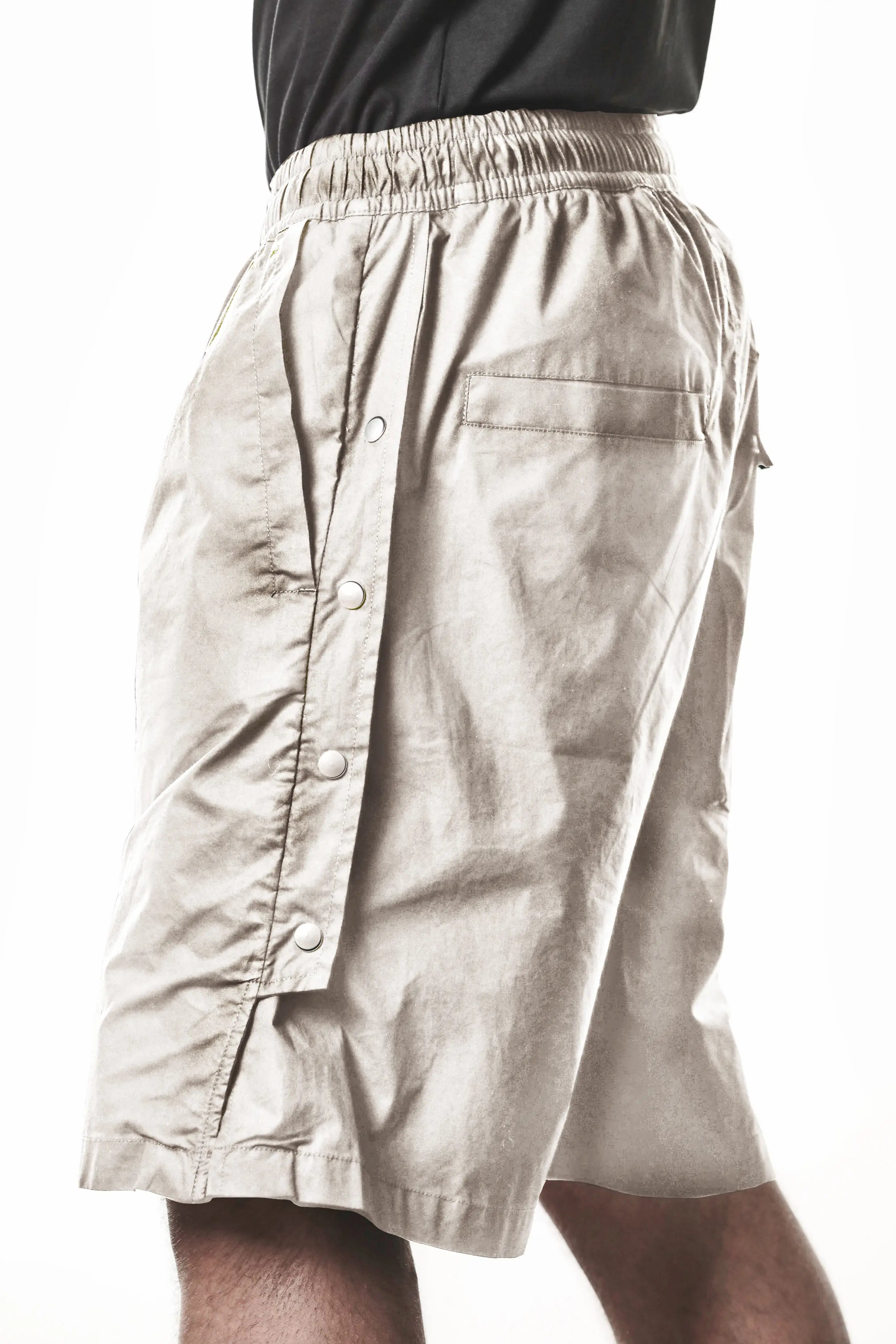 Thom Krom, Mens Shorts, Vegetal Stone, Over the Knee, Beige, Elasticated Waistband, Black Drawstring, Cargo Pockets, Side Pockets, Wide-fit, Drop-crotch, Close-up Side View. 