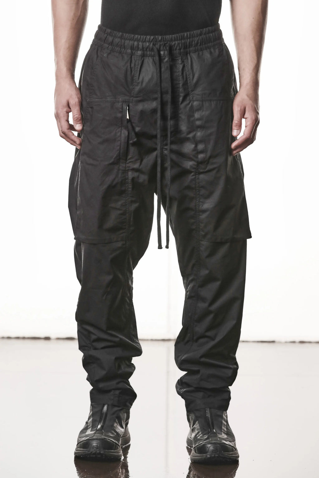 Thom Krom, Mens Pants, Black, Oversized, Wide-fit, Loose-fit, Large Front Pockets, Side Pockets, Back Pockets, Elasticated Waistband, Black Drawstring, Zip Pockets, YKK Zippers, Wide Ankles, Front View. 