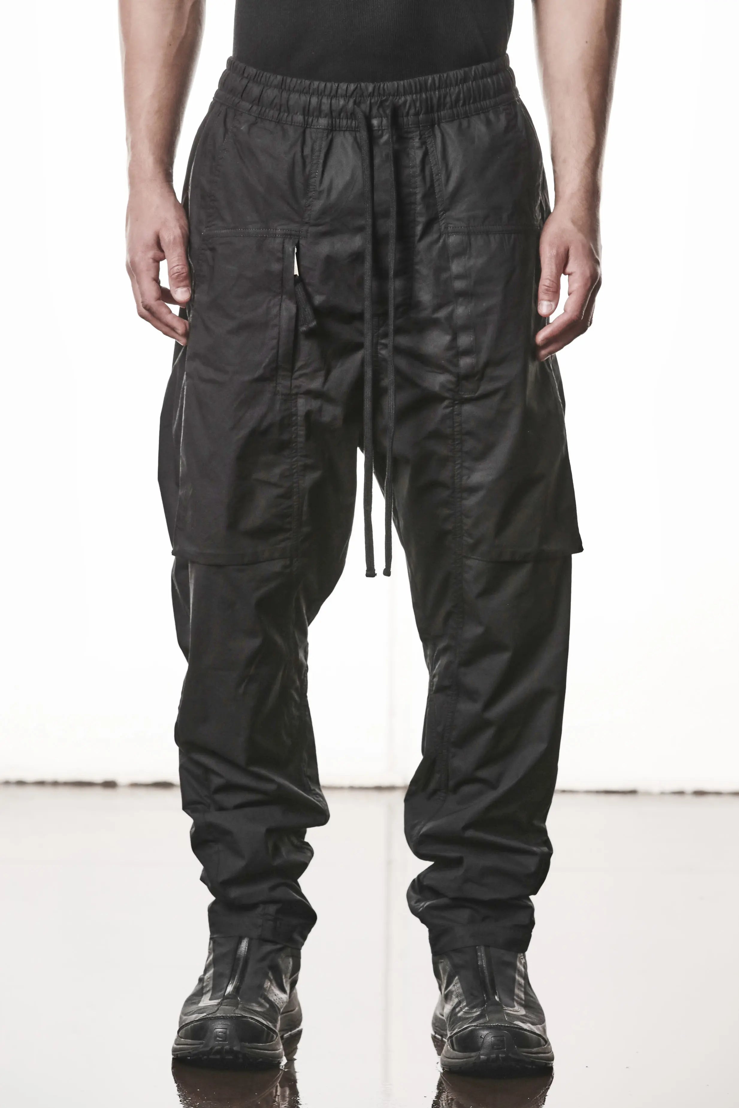 Thom Krom, Mens Pants, Black, Oversized, Wide-fit, Loose-fit, Large Front Pockets, Side Pockets, Back Pockets, Elasticated Waistband, Black Drawstring, Zip Pockets, YKK Zippers, Wide Ankles, Front View. 