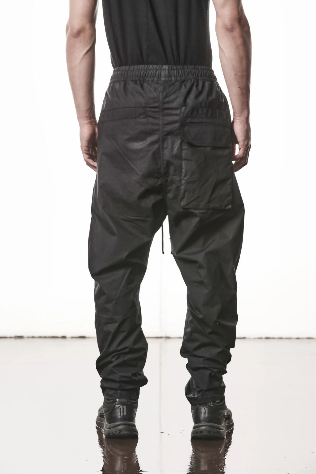 Thom Krom, Mens Pants, Black, Oversized, Wide-fit, Loose-fit, Large Front Pockets, Side Pockets, Back Pockets, Elasticated Waistband, Black Drawstring, Zip Pockets, YKK Zippers, Wide Ankles, Back View. 