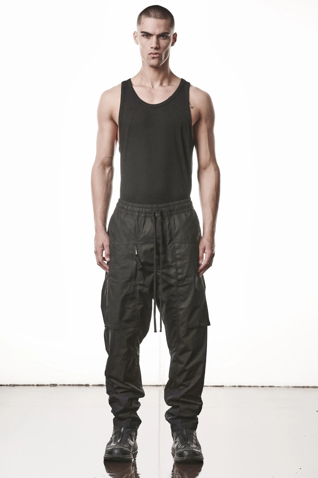 Thom Krom, Mens Pants, Black, Oversized, Wide-fit, Loose-fit, Large Front Pockets, Side Pockets, Back Pockets, Elasticated Waistband, Black Drawstring, Zip Pockets, YKK Zippers, Wide Ankles, Full Body Front View. 