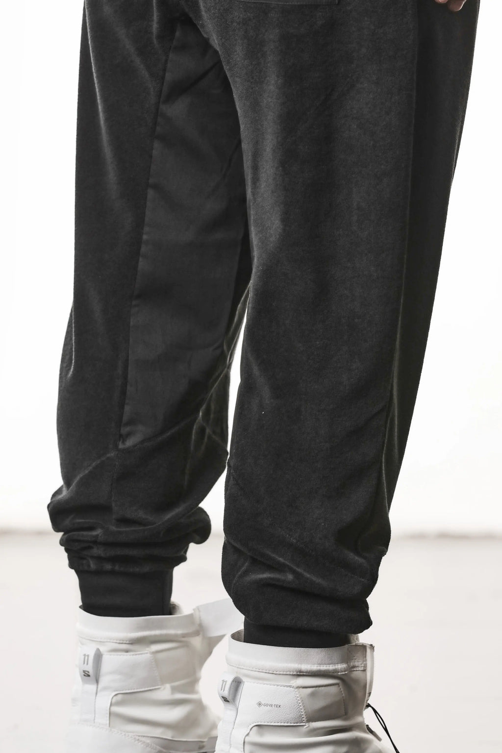 Thom Krom, Mens Pants, Black, Cotton Terry, Elasticated Waistband, Drawstring, Inserts, Side Pockets, Back Pockets, Ribbed Cuffs, The night is your friend, my love, Leg Fit Close-up. 