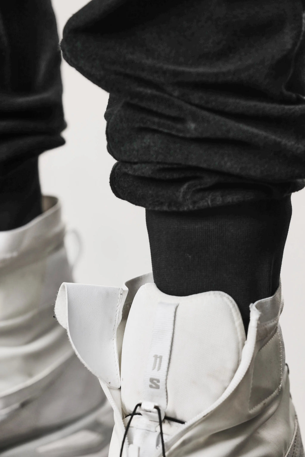 Thom Krom, Mens Pants, Black, Cotton Terry, Elasticated Waistband, Drawstring, Inserts, Side Pockets, Back Pockets, Ribbed Cuffs, The night is your friend, my love, Cuff Close-up. 