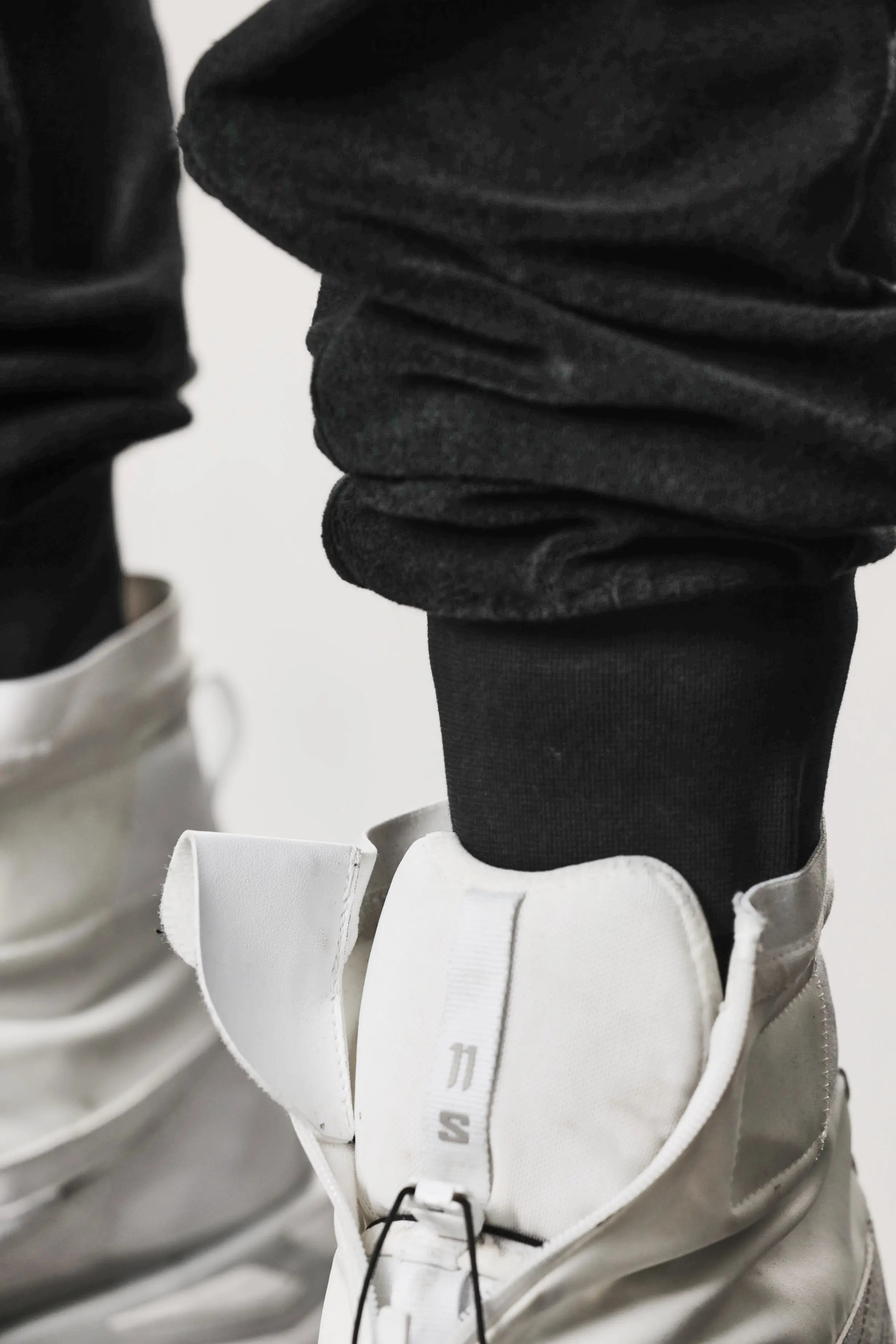 Thom Krom, Mens Pants, Black, Cotton Terry, Elasticated Waistband, Drawstring, Inserts, Side Pockets, Back Pockets, Ribbed Cuffs, The night is your friend, my love, Cuff Close-up. 