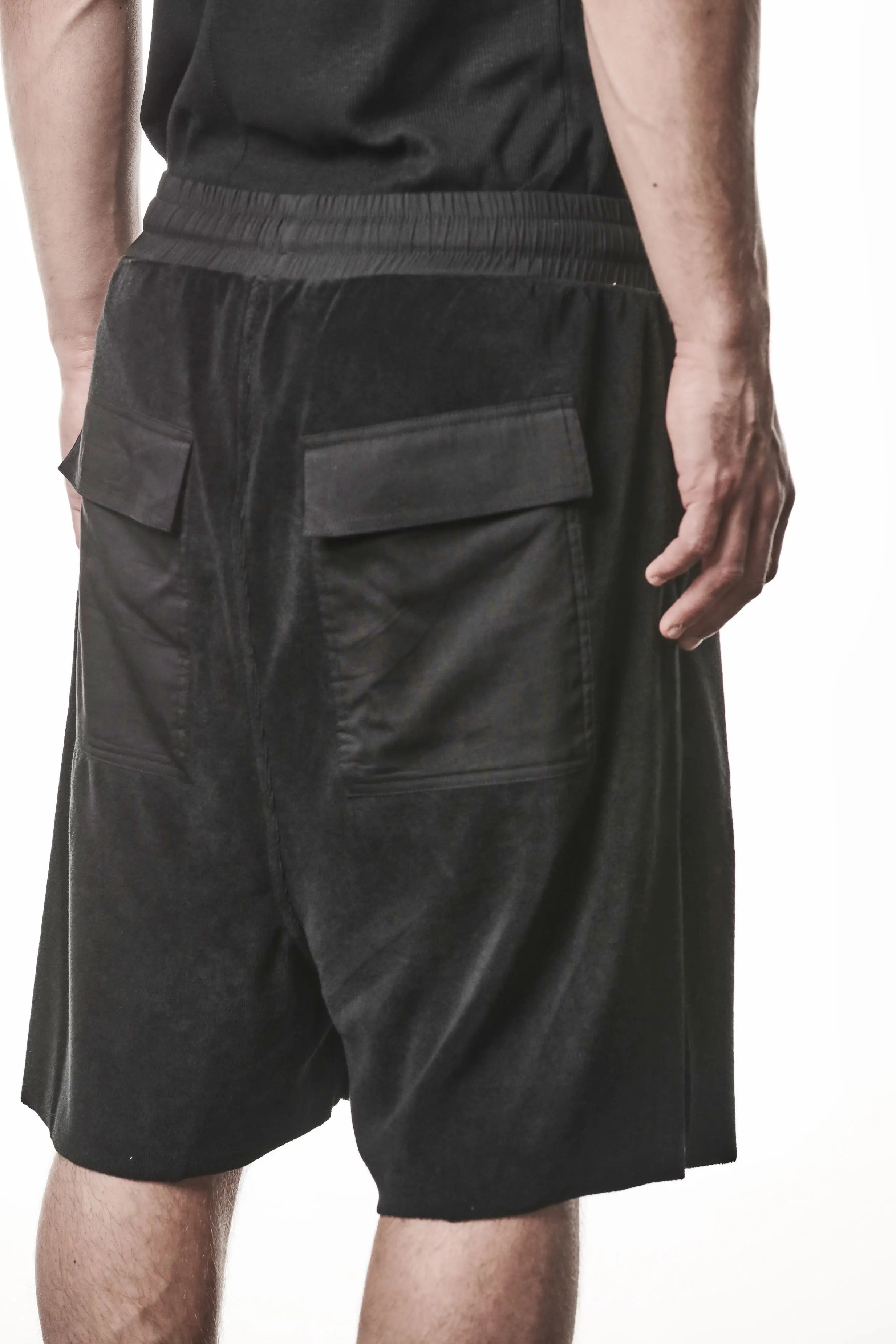 Thom Krom, Mens Shorts, Black, Elasticated Waistband, Drawstring, Raw cut hem and slits, Cotton Terry, Woven Inserts, 1/2 Legs, Side Pockets, Back Pockets 3/4 View Close-up. 