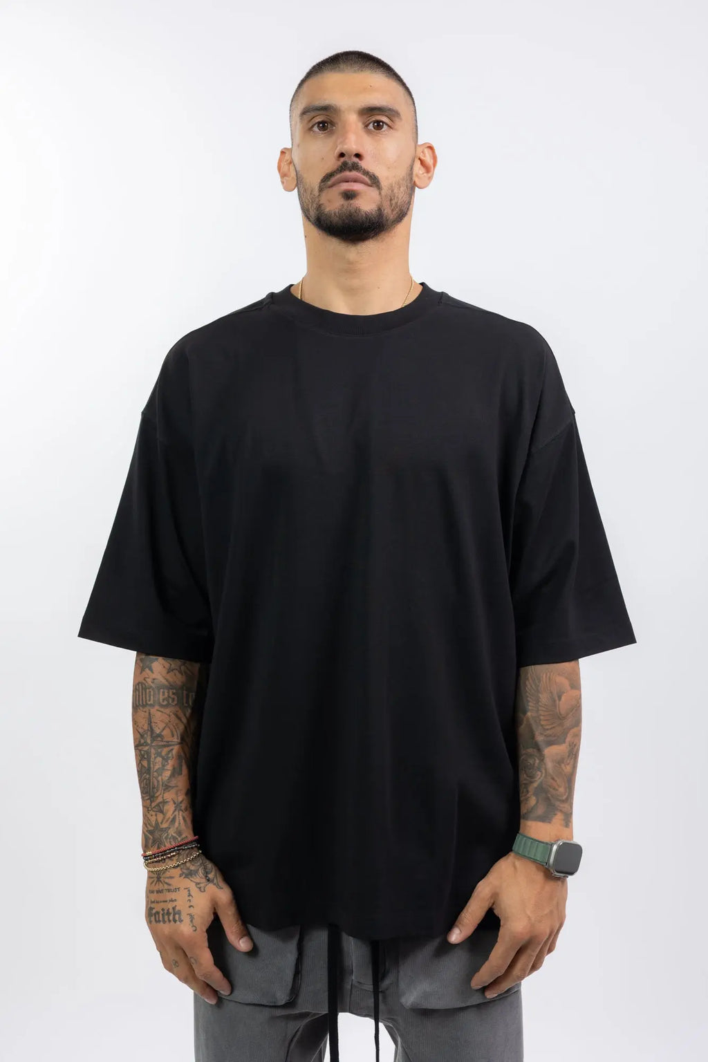 Thom Krom,Mens T-Shirt,Black,Oversized Fit,Round Crewneck,Embroidered Logo On The Back,Print At Backside,Straight Hemline,Folded Hems,Soft Strong Modal Jersey,Front Portrait.