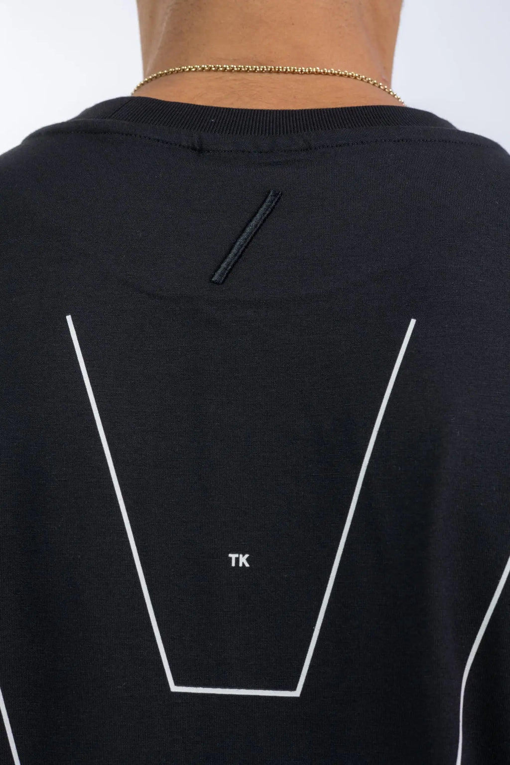 Thom Krom,Mens T-Shirt,Black,Oversized Fit,Round Crewneck,Embroidered Logo On The Back,Print At Backside,Straight Hemline,Folded Hems,Soft Strong Modal Jersey,Detailed Photo Of The Embroidered Logo And The Print.
