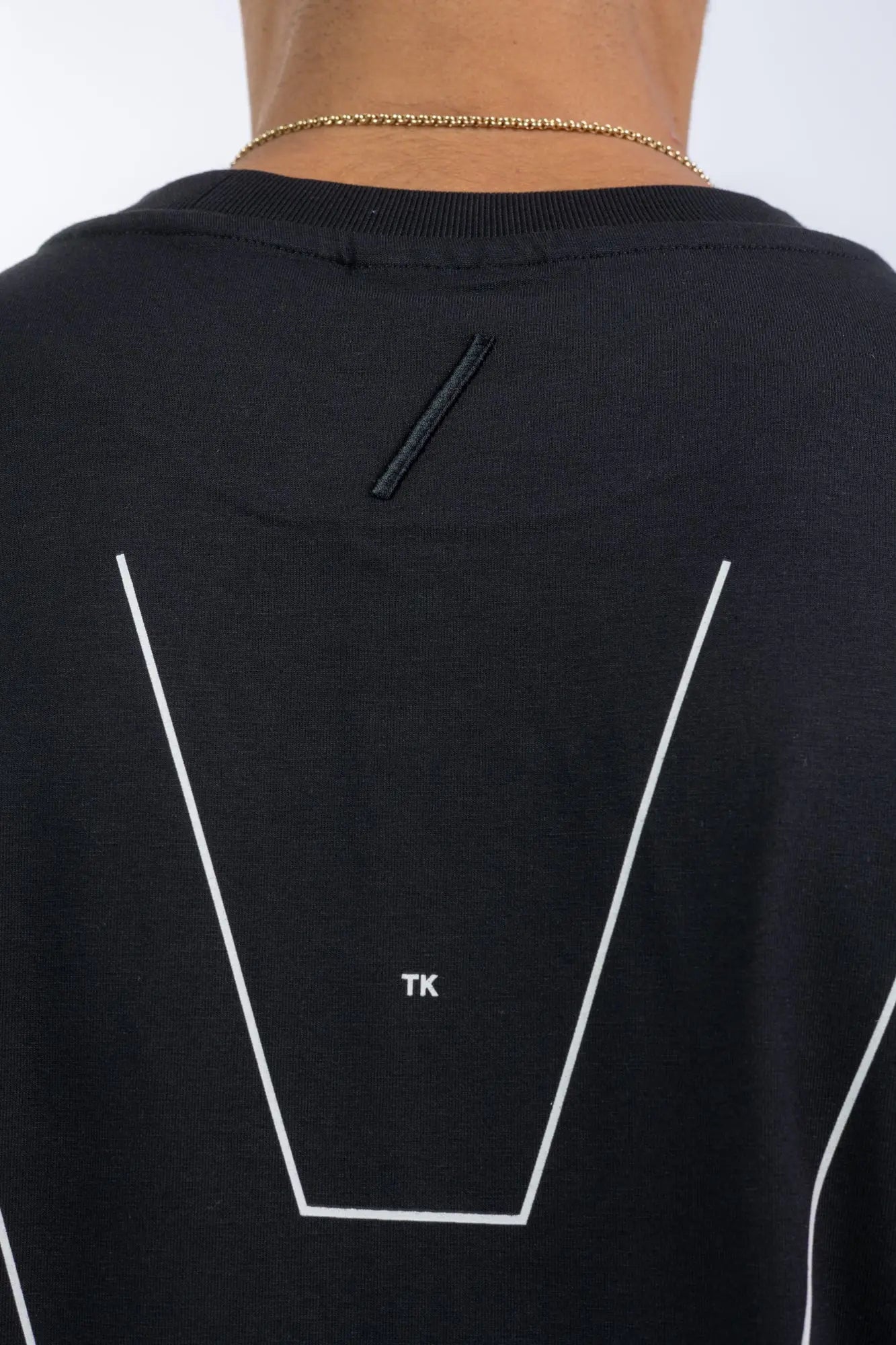 Thom Krom,Mens T-Shirt,Black,Oversized Fit,Round Crewneck,Embroidered Logo On The Back,Print At Backside,Straight Hemline,Folded Hems,Soft Strong Modal Jersey,Detailed Photo Of The Embroidered Logo And The Print.