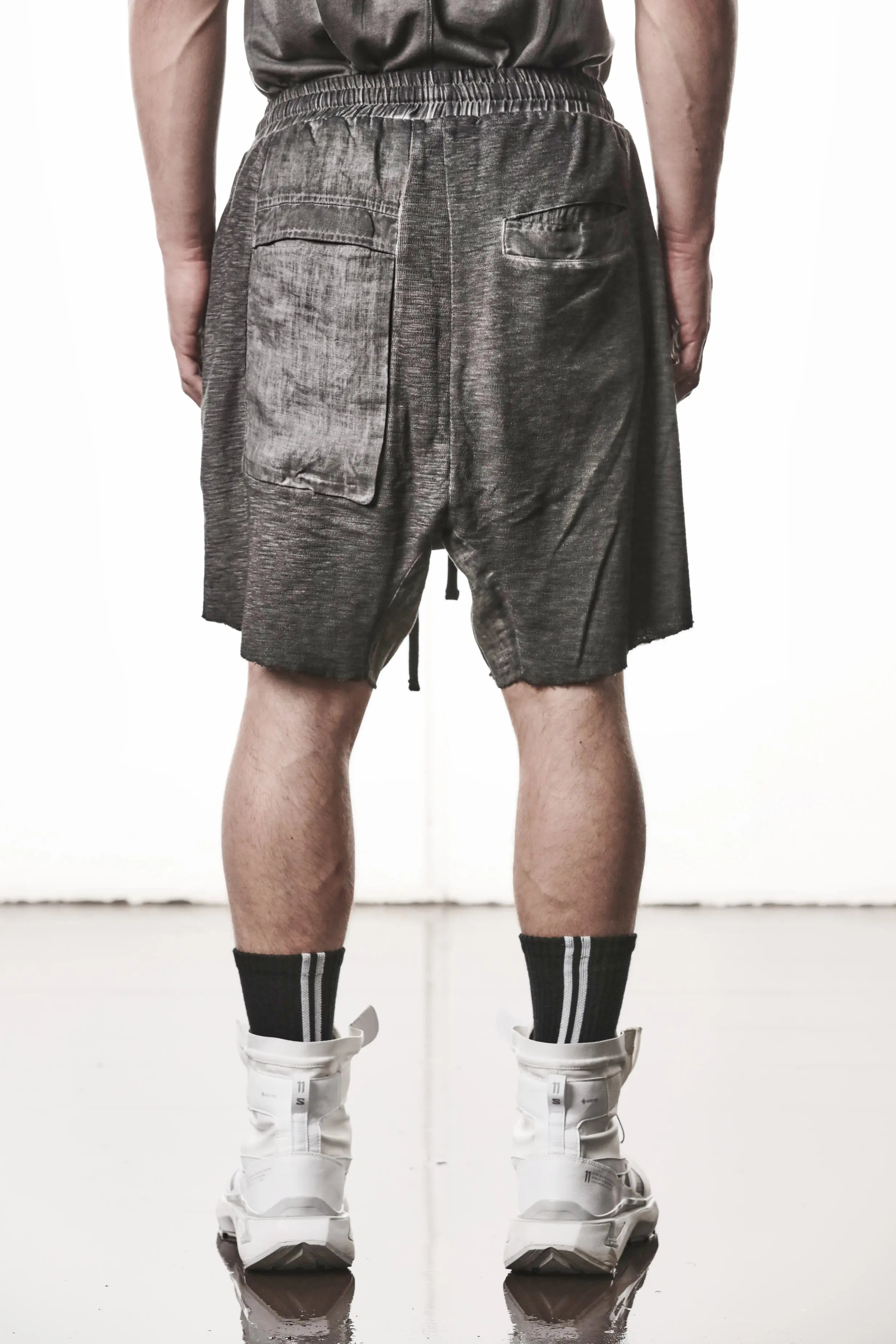 Thom Krom Shorts,Mens Shorts,Drop Crotch,Elasticated Waistband With Drawstrings,Regular Straight Fit,Raw Cut Hem Detailing,Lenght Above The Knee,Woven Linen Insert in Crotch,Bellow And Welt Pocket Construction,Cargo Pocket Patched With Woven Linen Panels,Backside Half Body Photo