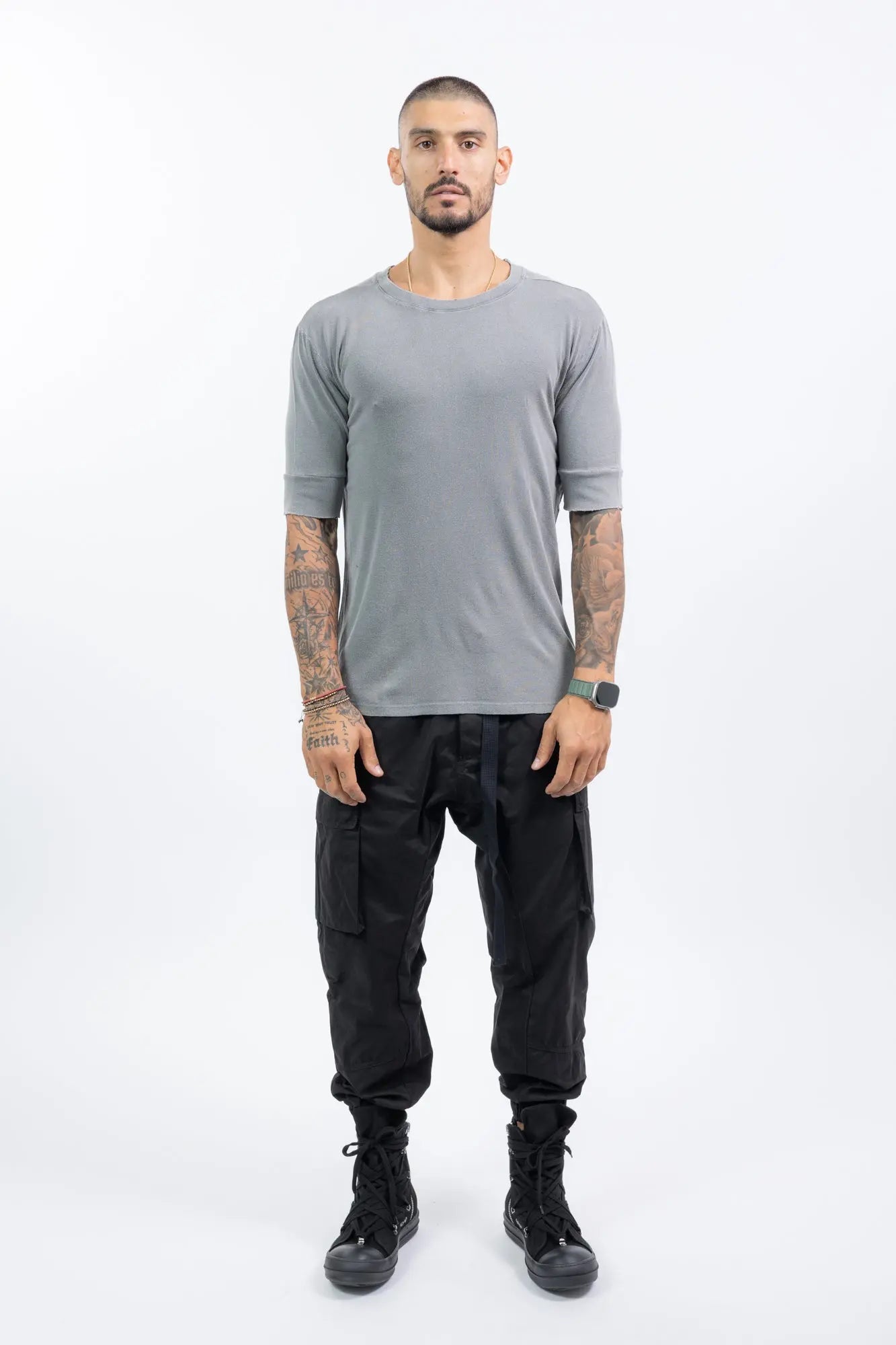 Thom Krom,Mens T-Shirt,Used Grey,Raw Cut Hems,Round  Distressed Crewneck,Straight Hemline,Back Center Seam Detail,Embroidered Logo On The Back,Long Sleeve Cut Detail,Front View.
