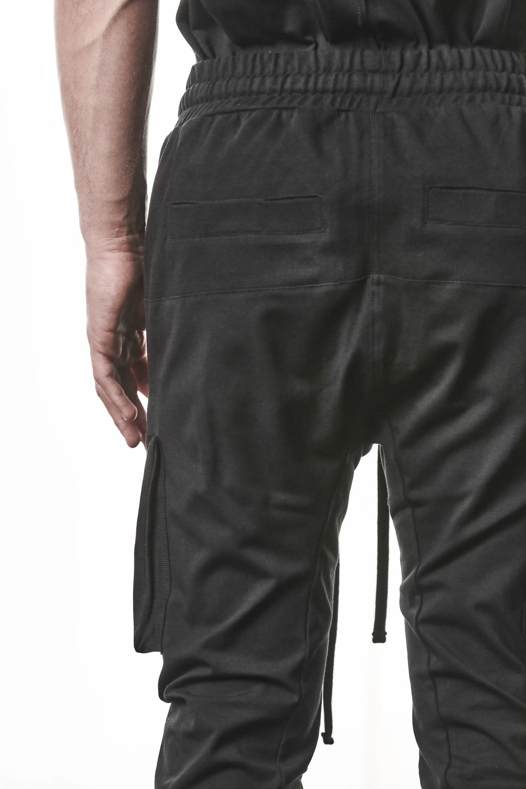 Thom Krom, Mens Pants, Black, Cargo Pockets, Stretch Cotton, Elastane, Spandex, Elasticated Waistband, Drawstring, Elasticated Cuffs, Long Legs, Regular Fit, Side Pockets, YKK Zippers, Close-up Back 3/4 View. 