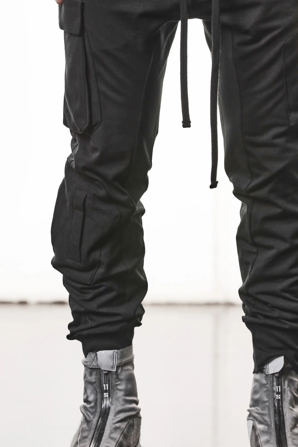 Thom Krom, Mens Pants, Black, Cargo Pockets, Stretch Cotton, Elastane, Spandex, Elasticated Waistband, Drawstring, Elasticated Cuffs, Long Legs, Regular Fit, Side Pockets, YKK Zippers, Close-up Cargo Pockets View. 
