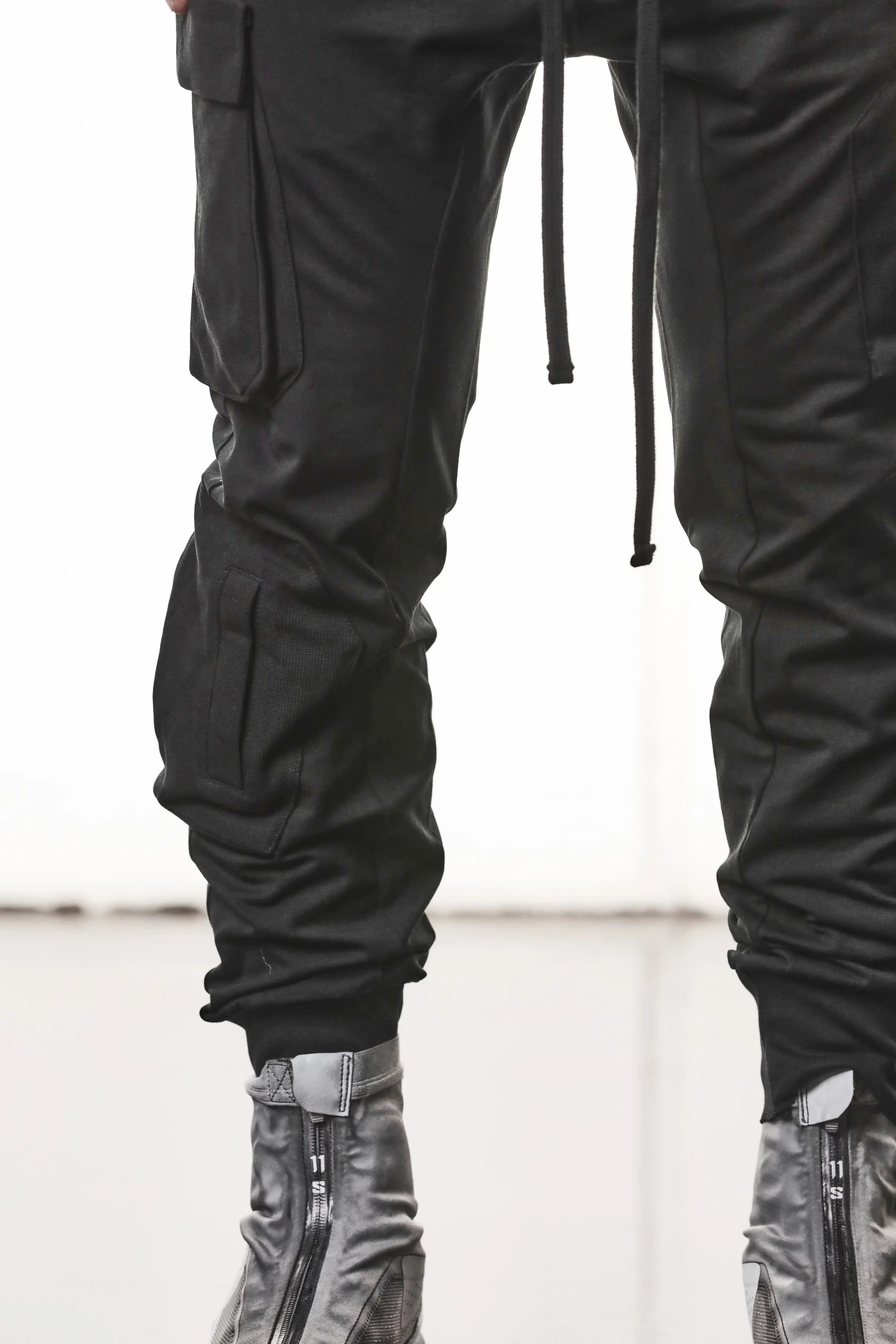 Thom Krom, Mens Pants, Black, Cargo Pockets, Stretch Cotton, Elastane, Spandex, Elasticated Waistband, Drawstring, Elasticated Cuffs, Long Legs, Regular Fit, Side Pockets, YKK Zippers, Close-up Cargo Pockets View. 