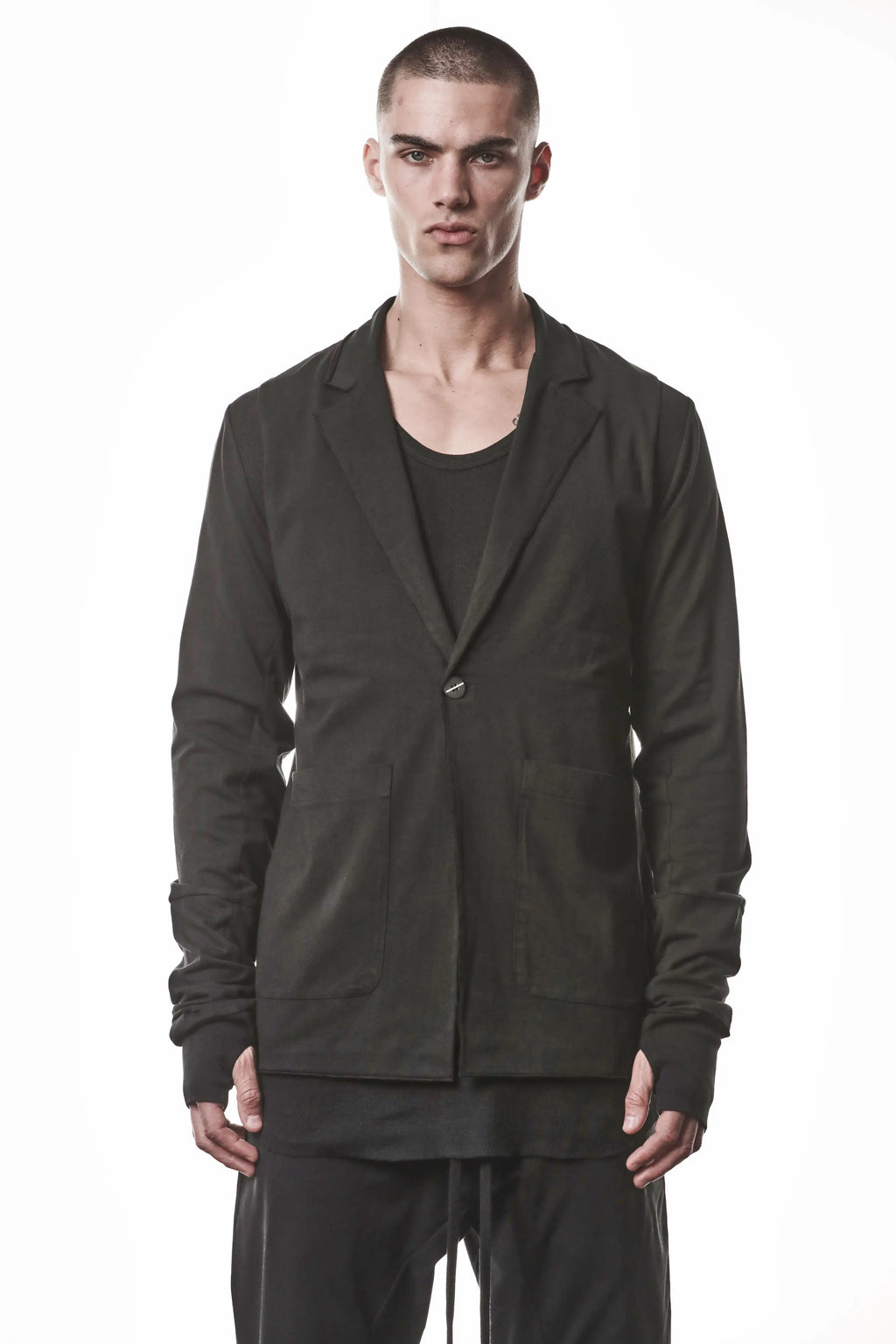 Thom Krom, Mens Blazer, Black, Shoulder Rib Patch, Thumbholes, 100% Cotton, Spandex, One Button, Thom Krom Button, Bellows Pockets, Long Sleeves, Regular Fit, Front Portrait View. 