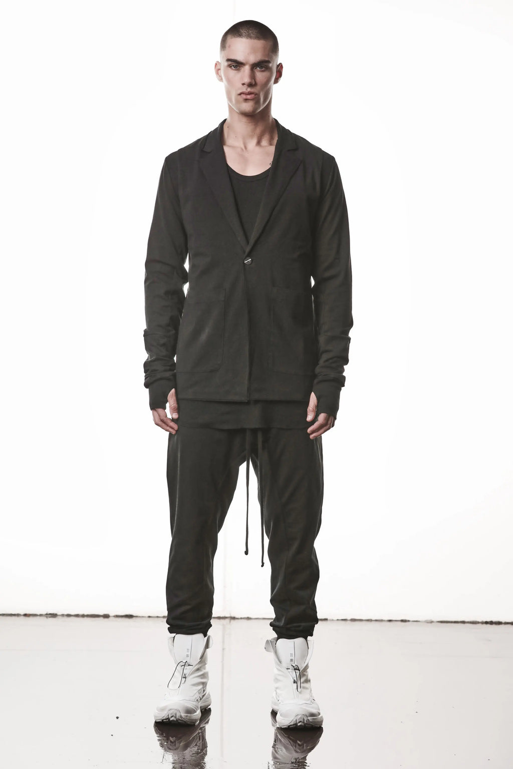 Thom Krom, Mens Blazer, Black, Shoulder Rib Patch, Thumbholes, 100% Cotton, Spandex, One Button, Thom Krom Button, Bellows Pockets, Long Sleeves, Regular Fit, Full Body Front View. 