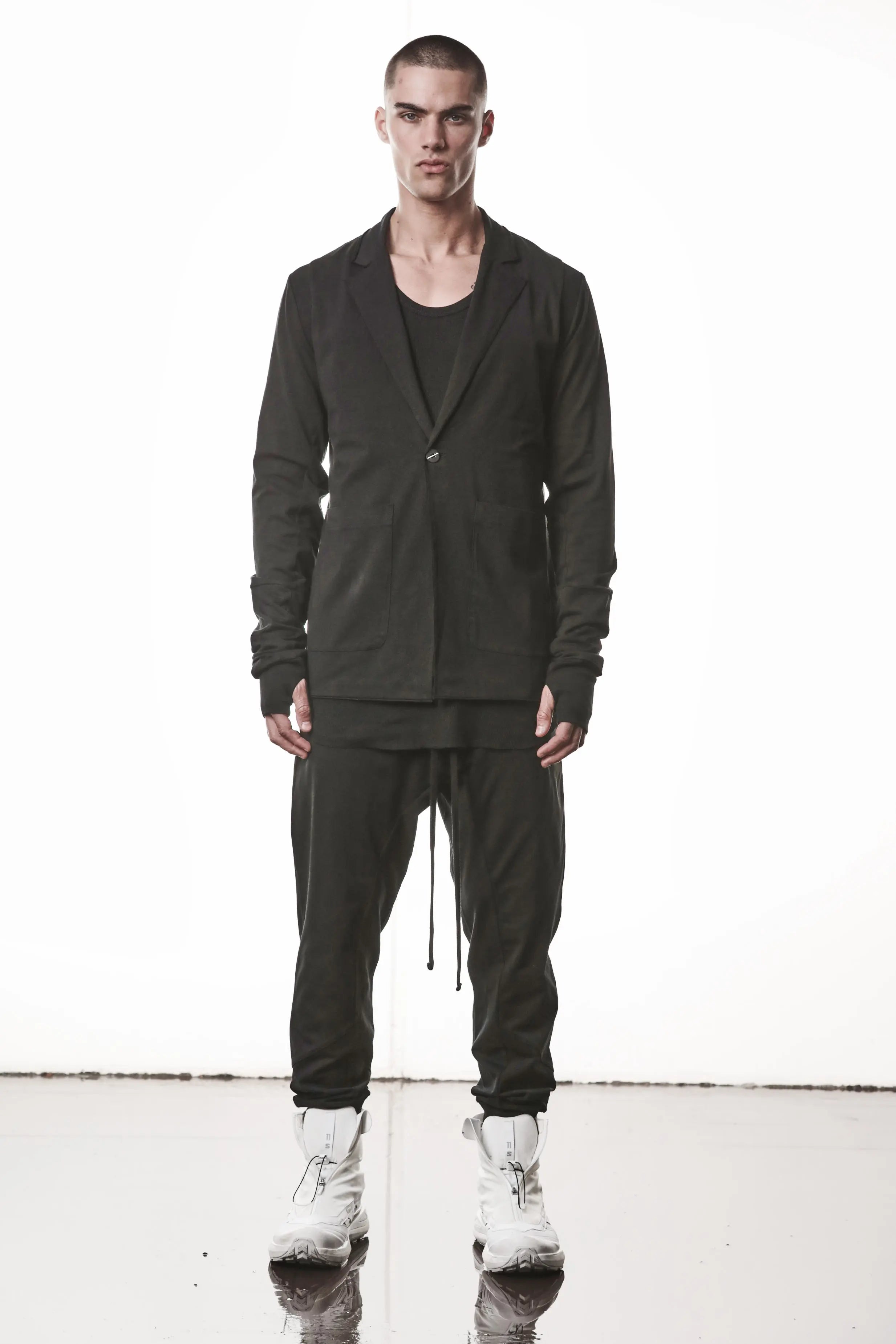 Thom Krom, Mens Blazer, Black, Shoulder Rib Patch, Thumbholes, 100% Cotton, Spandex, One Button, Thom Krom Button, Bellows Pockets, Long Sleeves, Regular Fit, Full Body Front View. 