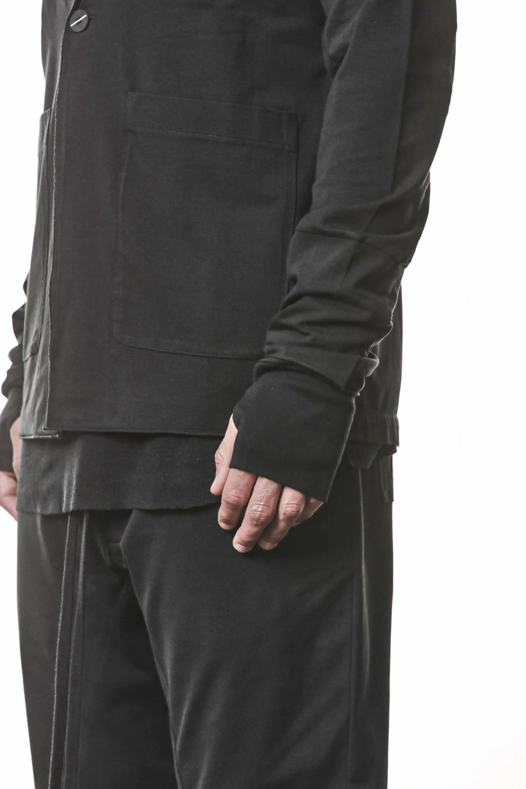 Thom Krom, Mens Blazer, Black, Shoulder Rib Patch, Thumbholes, 100% Cotton, Spandex, One Button, Thom Krom Button, Bellows Pockets, Long Sleeves, Regular Fit, Close-up Front 3/4 View. 