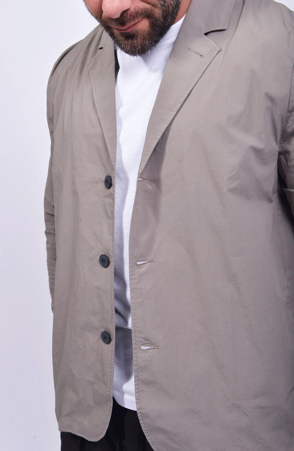 Thom Krom, Mens Blazer, Rock, Long Sleeves, Stand Up Collar, V-Neck, Three-Button Closure, White T-Shirt, Mid Length, Side Pockets, Close-up Unbuttoned. 