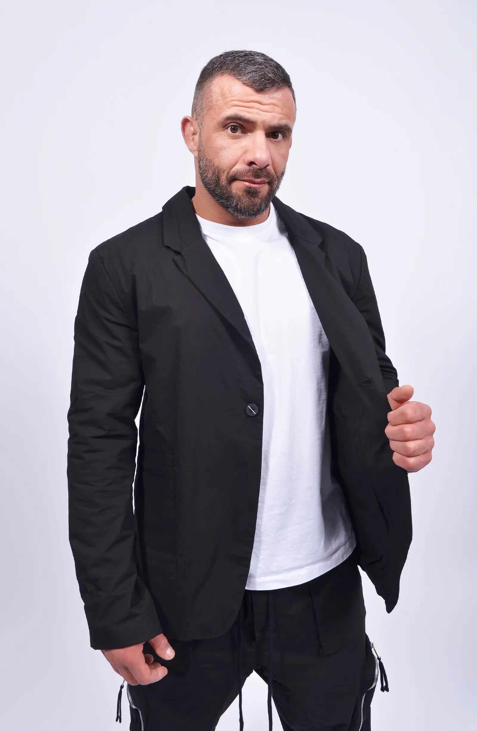 Thom Krom, Mens Blazer, Black, Collar, V-Neck, One-Button, Long Sleeves, White T-Shirt, Mid Length, Stretch Cotton, Washed/Crashed Quality, Patched Pockets, Front 3/4 Portrait View. 