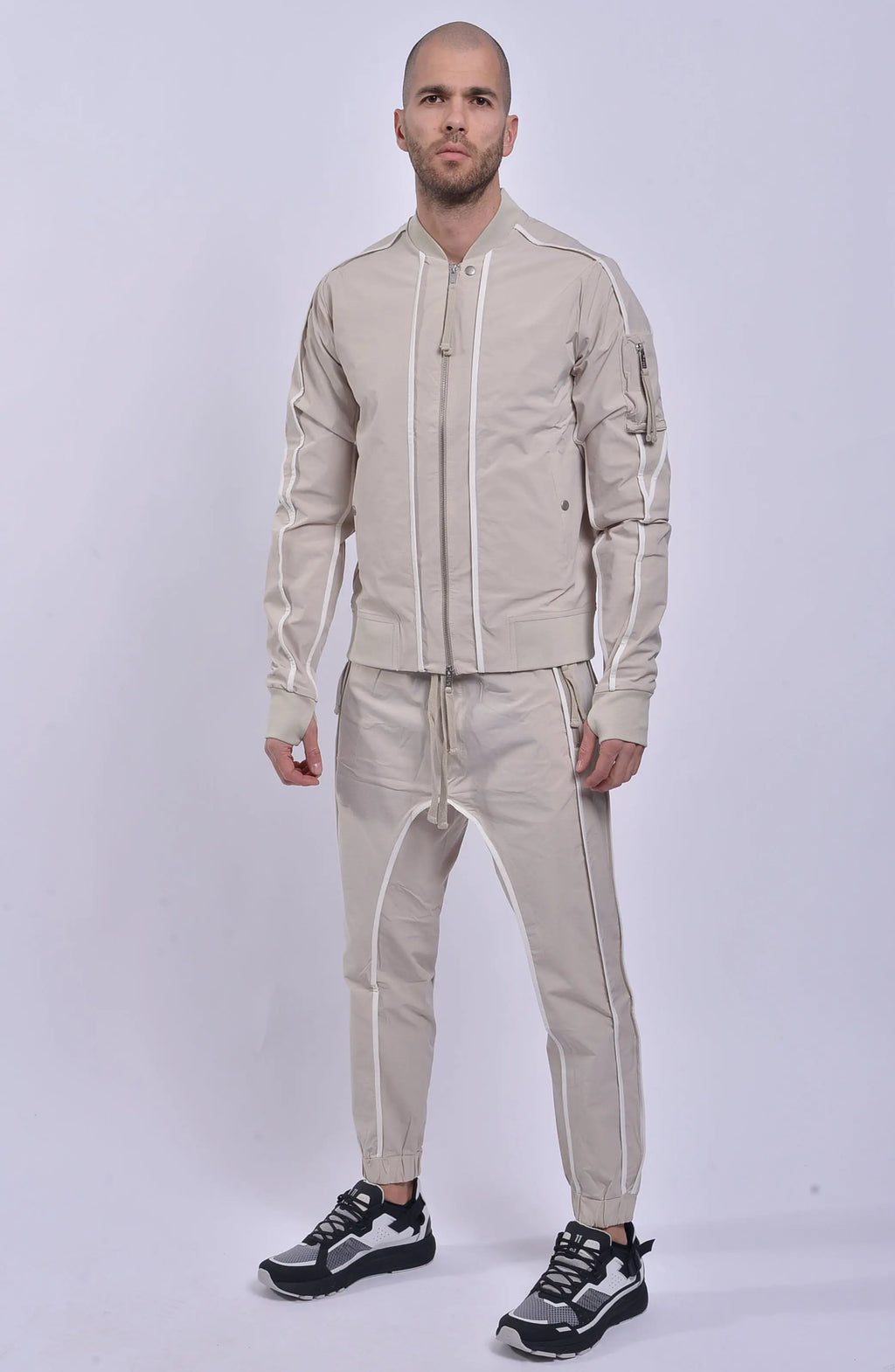 Thom Krom, Mens Jacket, Sand Shell, Ivory, Beige, Contrast Details, Thumbholes, Full-zip, YKK Zippers, Side Pockets, Sleeve Zip Pocket, Thom Krom Snap, White Detailing, Full Body Front 3/4 View. 