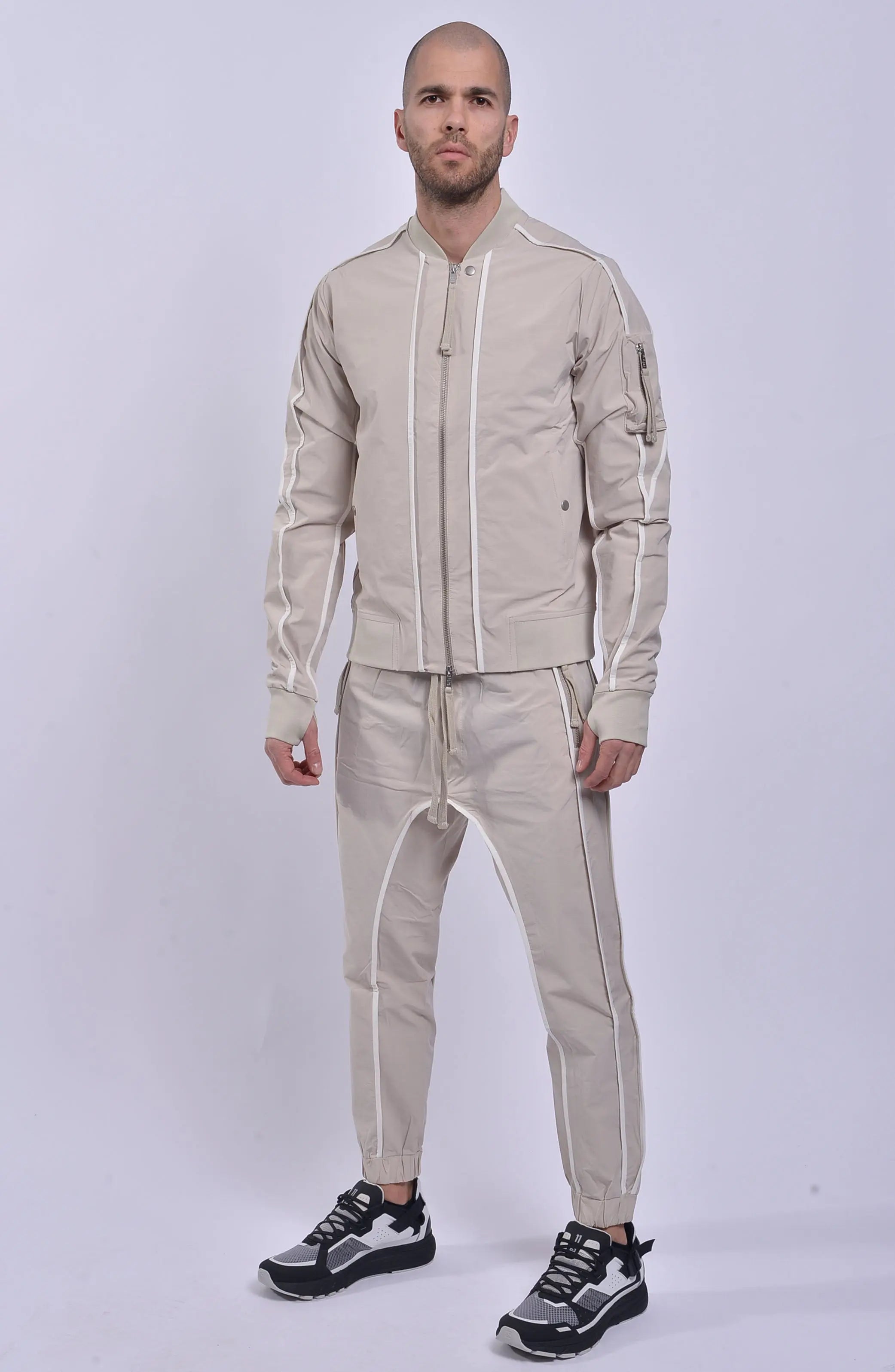 Thom Krom, Mens Jacket, Sand Shell, Ivory, Beige, Contrast Details, Thumbholes, Full-zip, YKK Zippers, Side Pockets, Sleeve Zip Pocket, Thom Krom Snap, White Detailing, Full Body Front 3/4 View. 