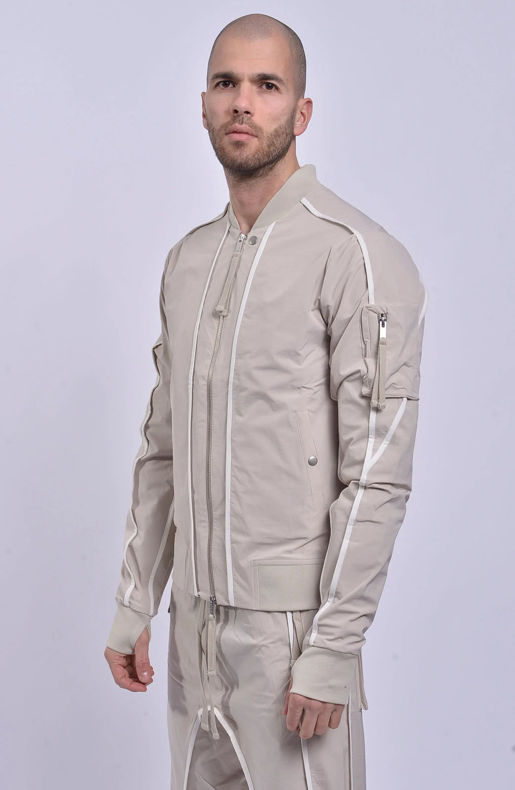 Thom Krom, Mens Jacket, Sand Shell, Ivory, Beige, Contrast Details, Thumbholes, Full-zip, YKK Zippers, Side Pockets, Sleeve Zip Pocket, Thom Krom Snap, White Detailing, Front Portrait 3/4 View. 