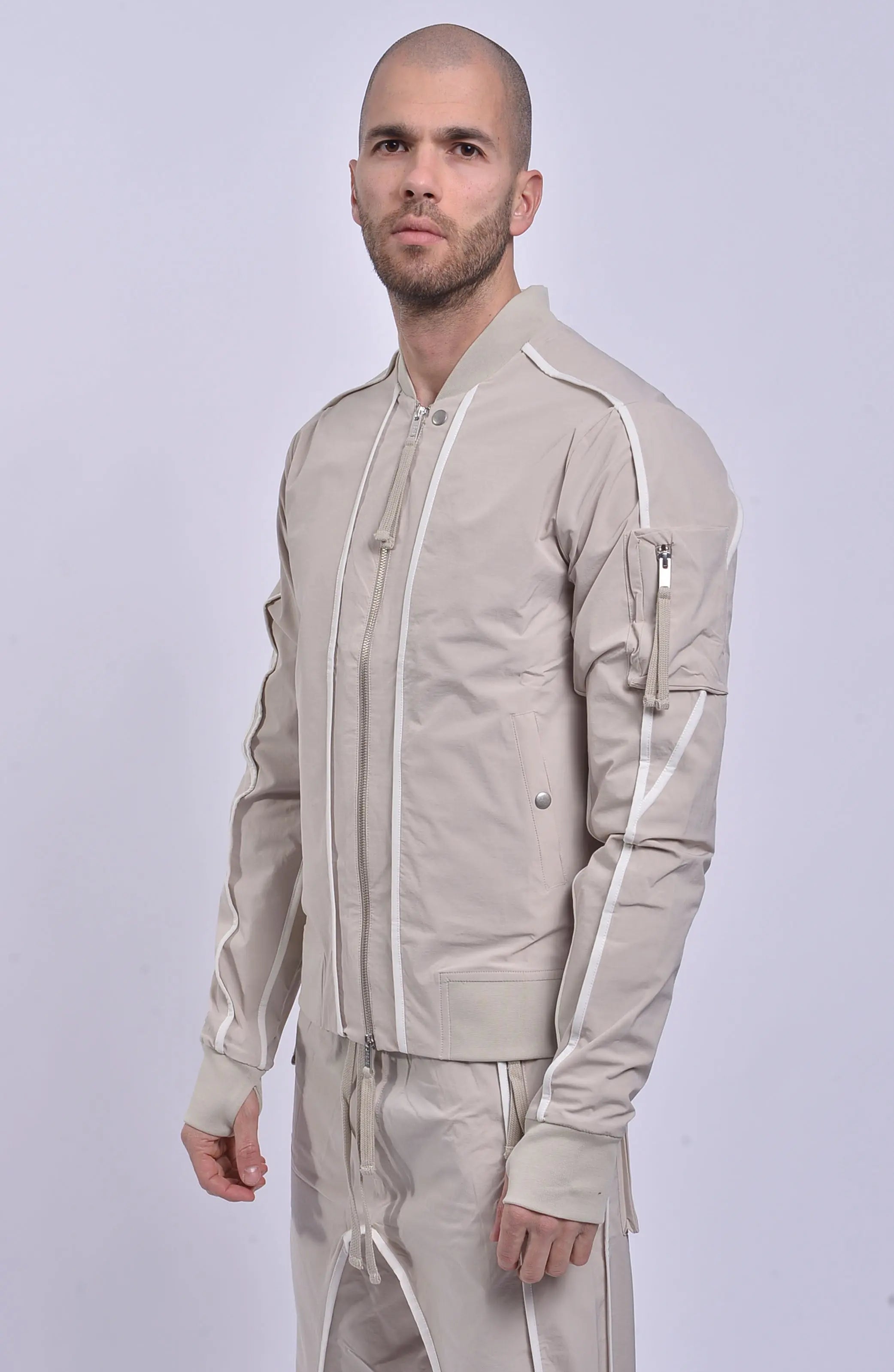 Thom Krom, Mens Jacket, Sand Shell, Ivory, Beige, Contrast Details, Thumbholes, Full-zip, YKK Zippers, Side Pockets, Sleeve Zip Pocket, Thom Krom Snap, White Detailing, Front Portrait 3/4 View. 