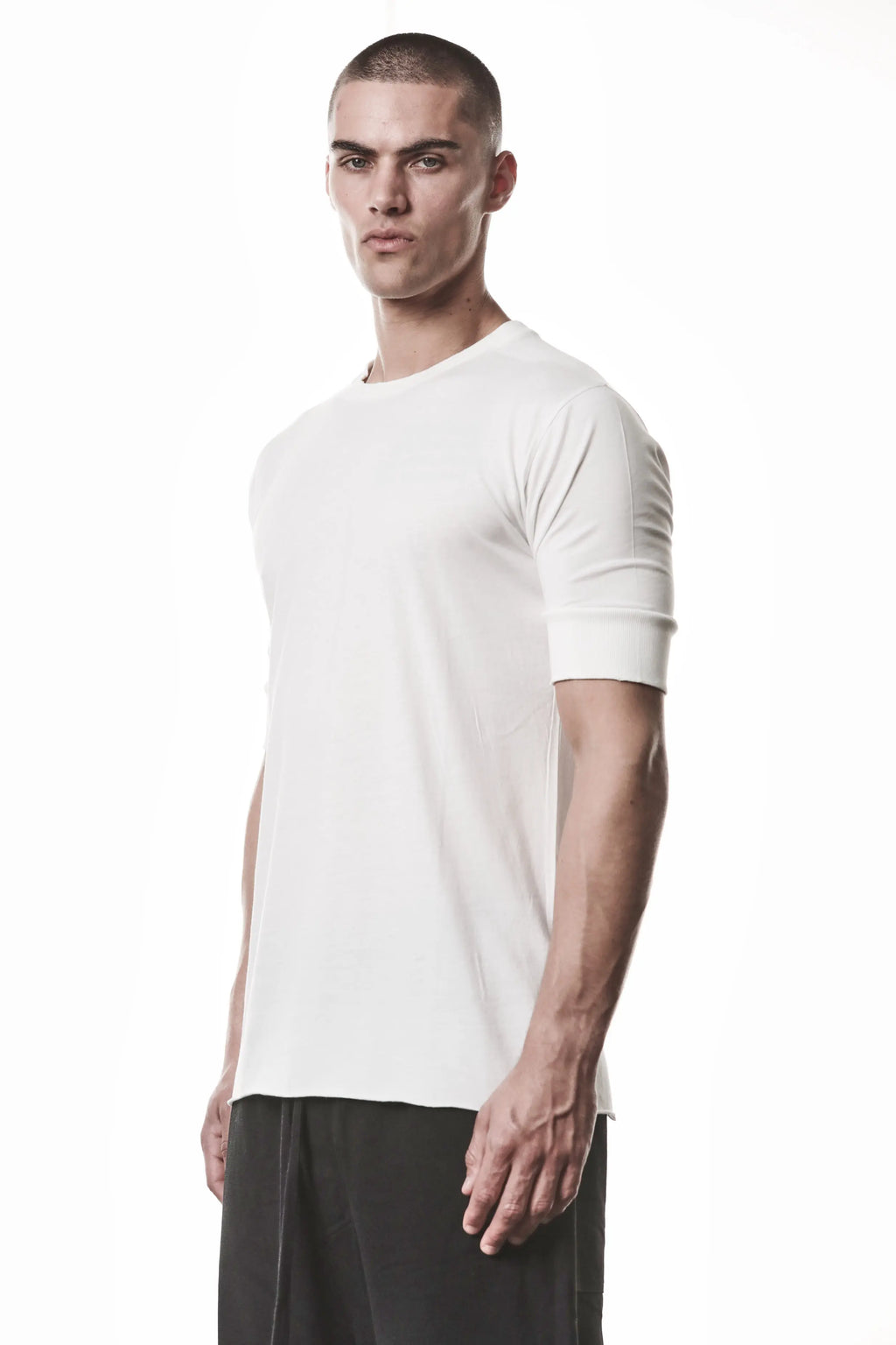 Thom Krom, Mens T-Shirt, Off-White, Cotton Modal Jersey, Ribbed Cuffs, Short Sleeves, Round Neck, Slim fit, Portrait 3/4 View. 