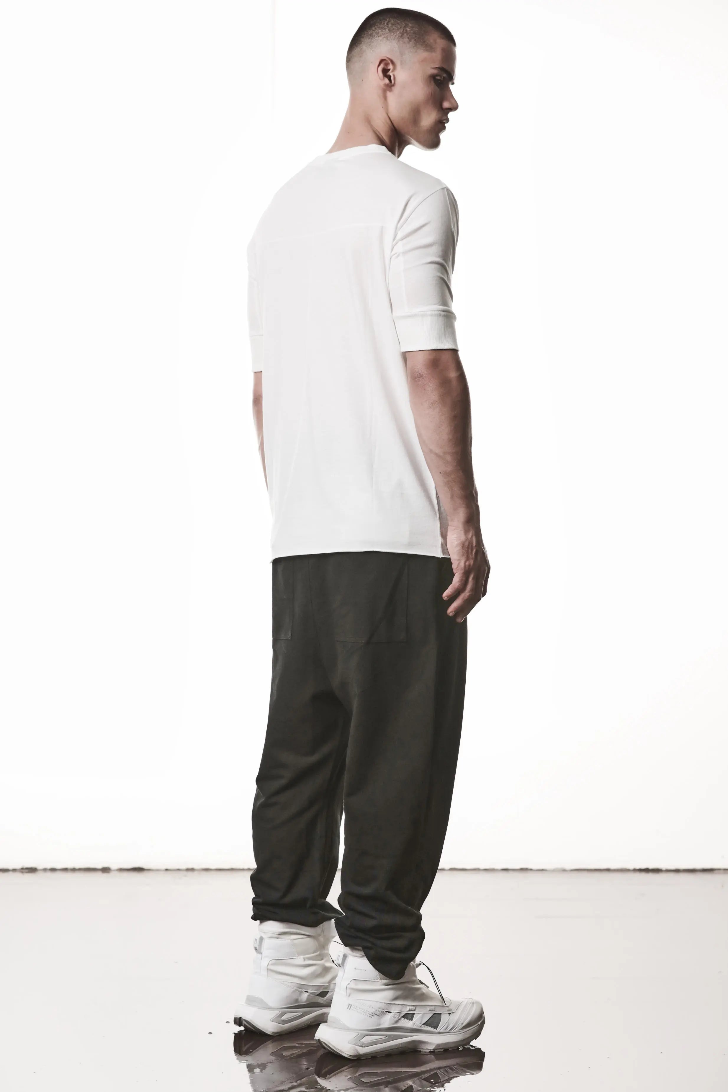 Thom Krom, Mens T-Shirt, Off-White, Cotton Modal Jersey, Ribbed Cuffs, Short Sleeves, Round Neck, Slim fit, Full Body 3/4 Back View. 