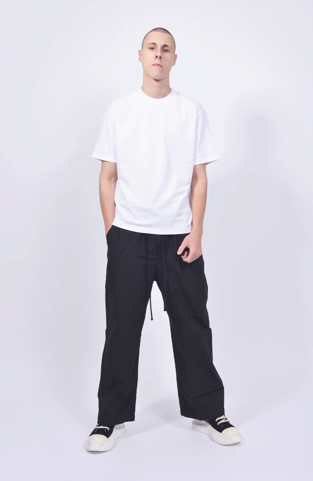Thom Krom, Mens Pants, Black, Wide Fit, Oversized Trousers, Elasticated Waistband, Drawstring, Side Pockets, Straight Legs, Back Pockets, Full Body Front View. 