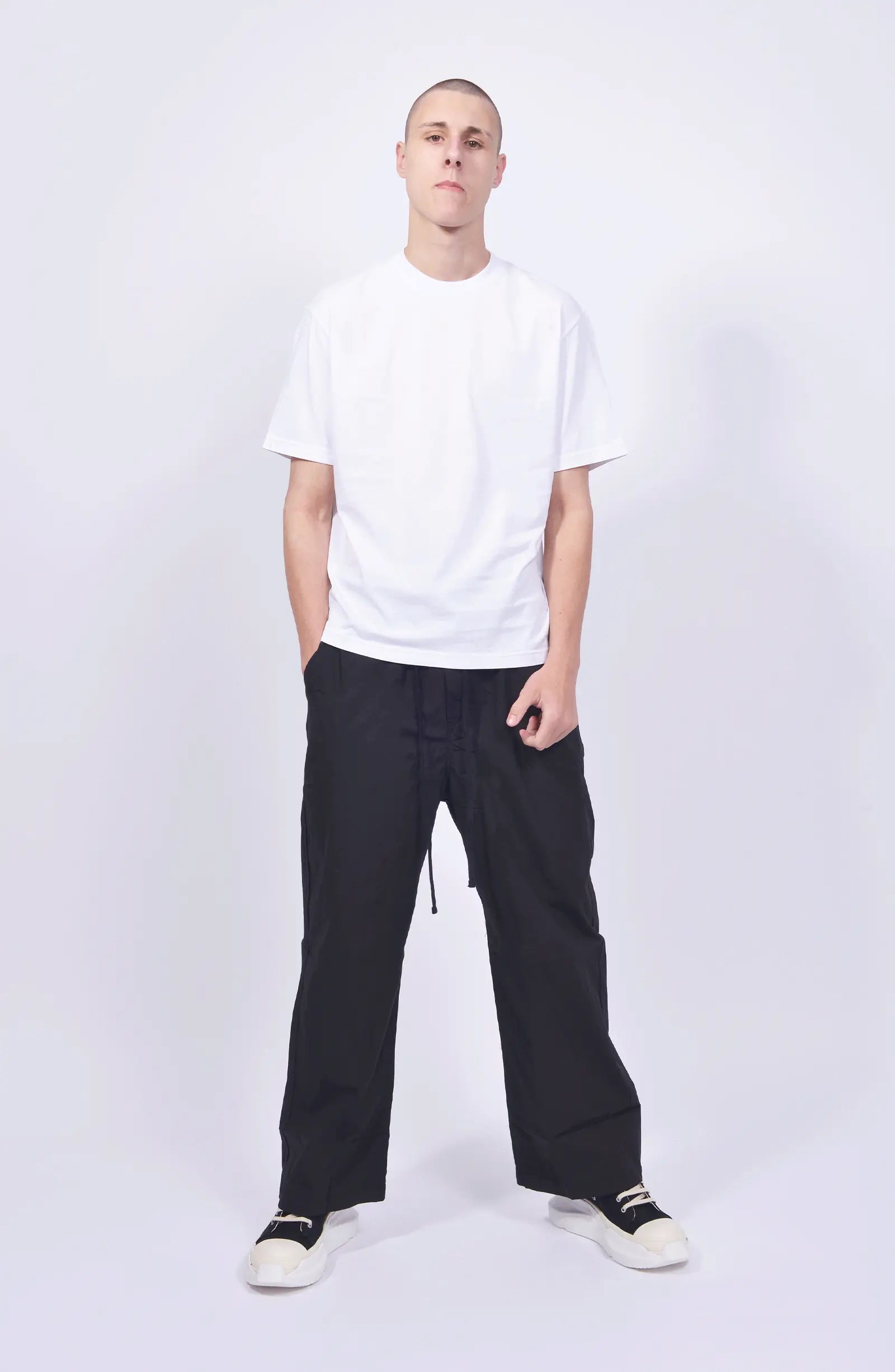 Thom Krom, Mens Pants, Black, Wide Fit, Oversized Trousers, Elasticated Waistband, Drawstring, Side Pockets, Straight Legs, Back Pockets, Full Body Front View. 