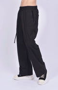 Thom Krom, Mens Pants, Black, Wide Fit, Oversized Trousers, Elasticated Waistband, Drawstring, Side Pockets, Straight Legs, Back Pockets, Front 3/4 View. 
