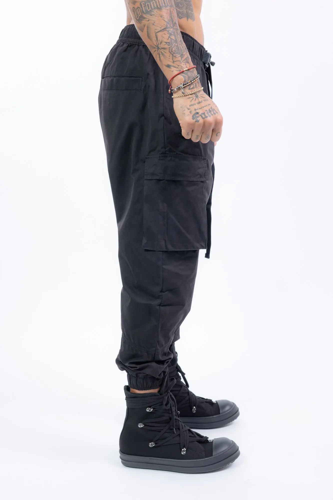 Thom Krom,Mens Cargo Trousers,Black,Elasticated Cuffs,Integrated Cinch Belt,Cargo Pockets On The Sides,Zippered Front Pockets,Profile Photo