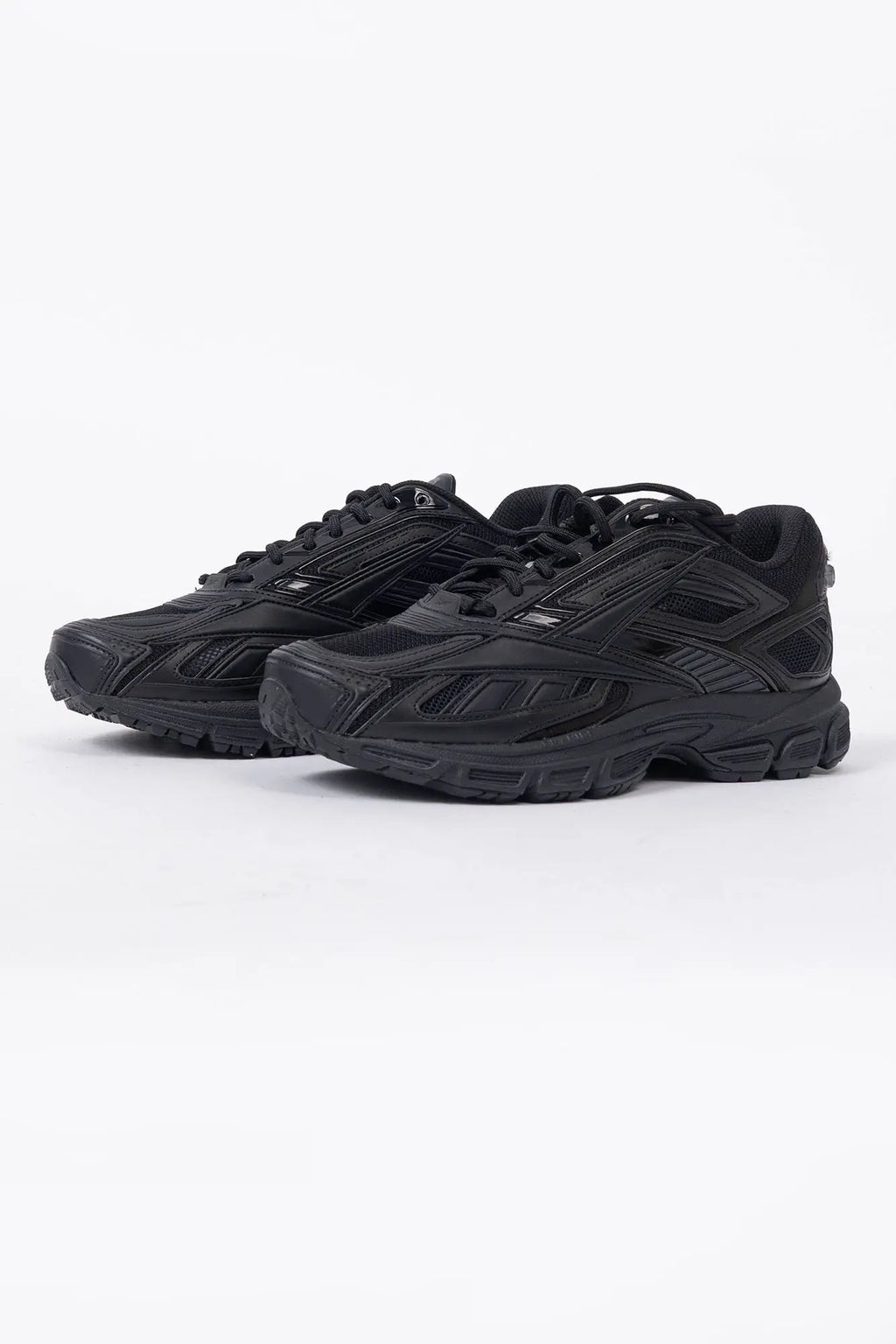 Reebok, Mens Sneakers, Black, dual-density midsole with DMX cushioning technology, TPU midfoot Shank for Support, Rubber Outsole, Breathable Mesh, Leather Overlays, All Black Modern Technical Style Sneaker, Front 3/4 View. 