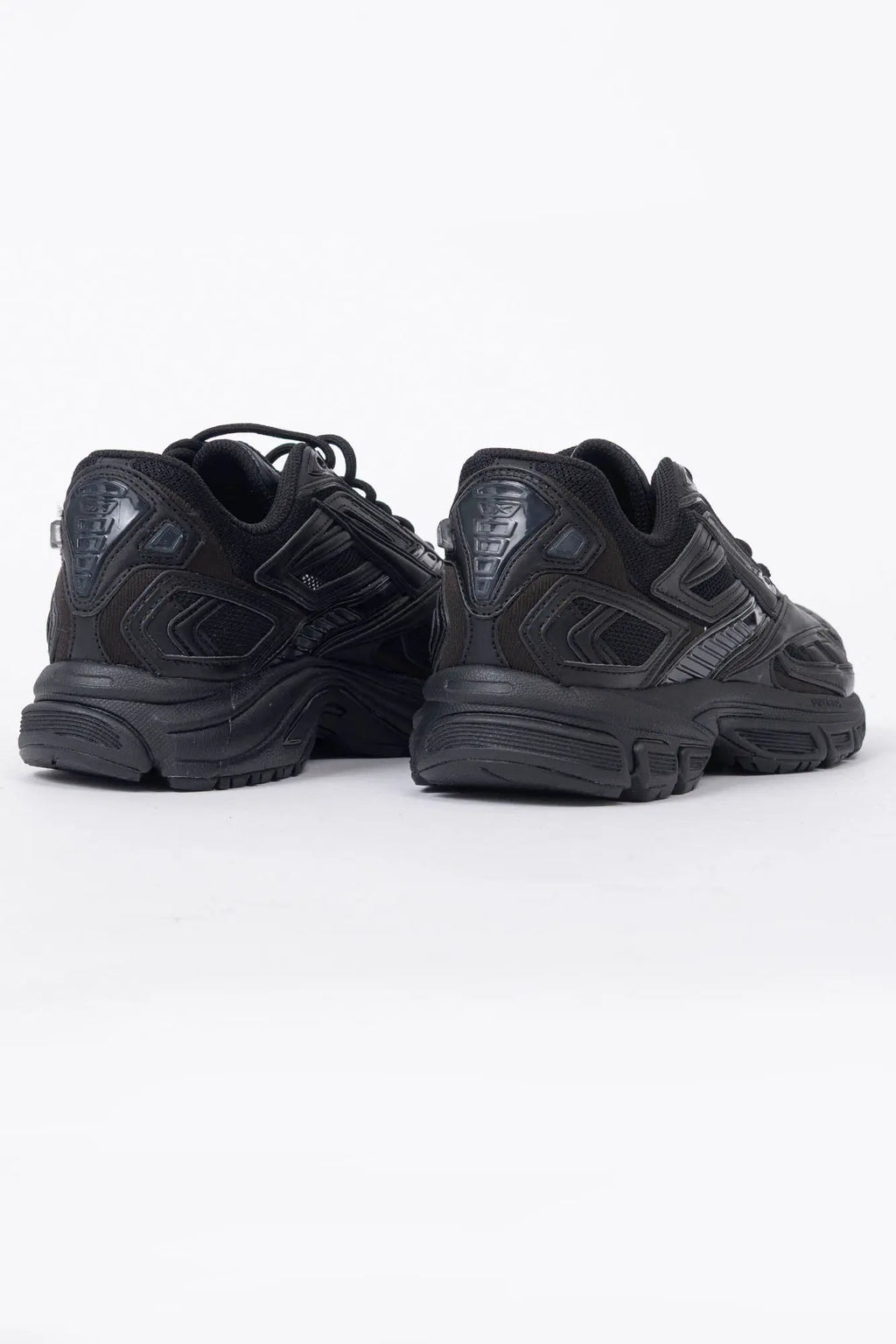Reebok, Mens Sneakers, Black, dual-density midsole with DMX cushioning technology, TPU midfoot Shank for Support, Rubber Outsole, Breathable Mesh, Leather Overlays, All Black Modern Technical Style Sneaker, Back 3/4 View. 