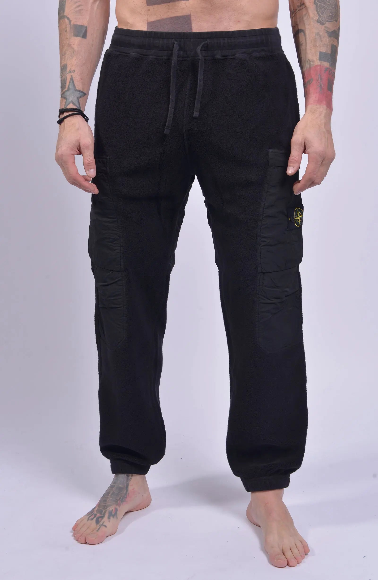 Stone Island, Mens Pants, Black V0029, Tattoos, Grenade tattoo, Drawstring, Elasticated Ankles, Compass Badge, Stone Island Badge, Side Pockets, Front Shot. 