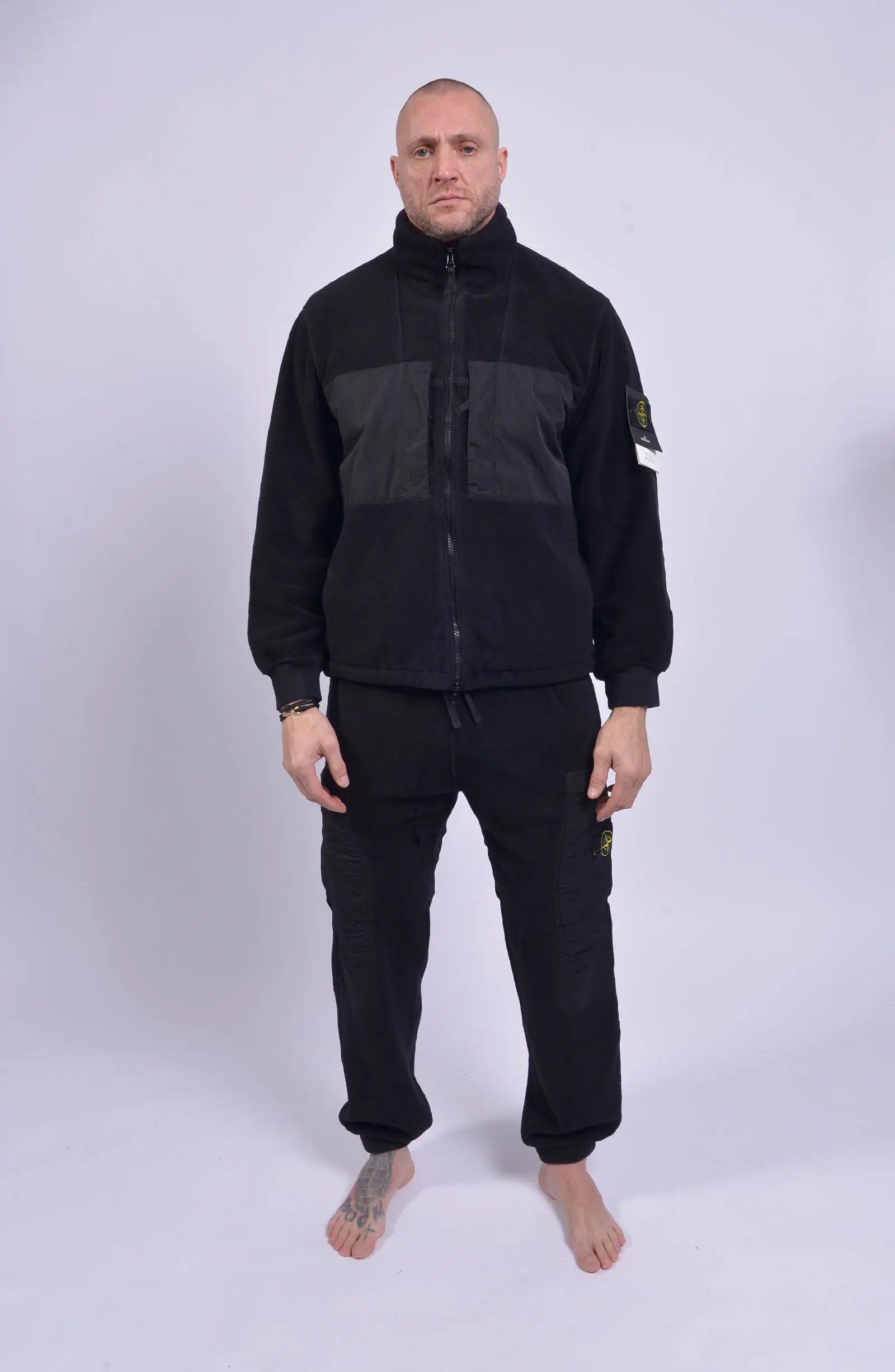 Stone Island, Mens Pants, Black V0029, Tattoos, Grenade tattoo, Drawstring, Elasticated Ankles, Compass Badge, Stone Island Badge, Side Pockets, Full Body Front Shot. 