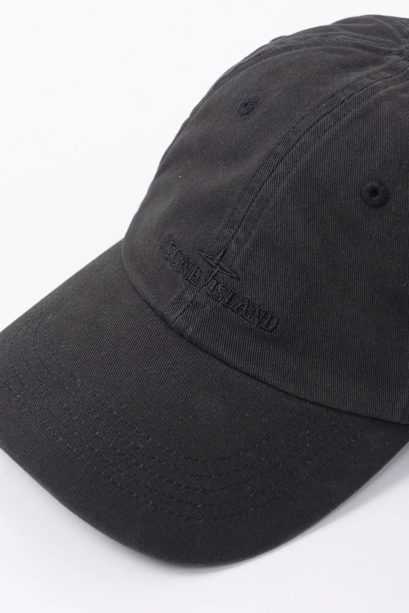 Stone Island, Mens Cap, Baseball Cap, Black V0029, Brushed Cotton Gabardine, Engraved Metal Clip Buckle, Compass Logo, Logo Embroidery, Adjustable Strap, 3/4 Top Down View. 