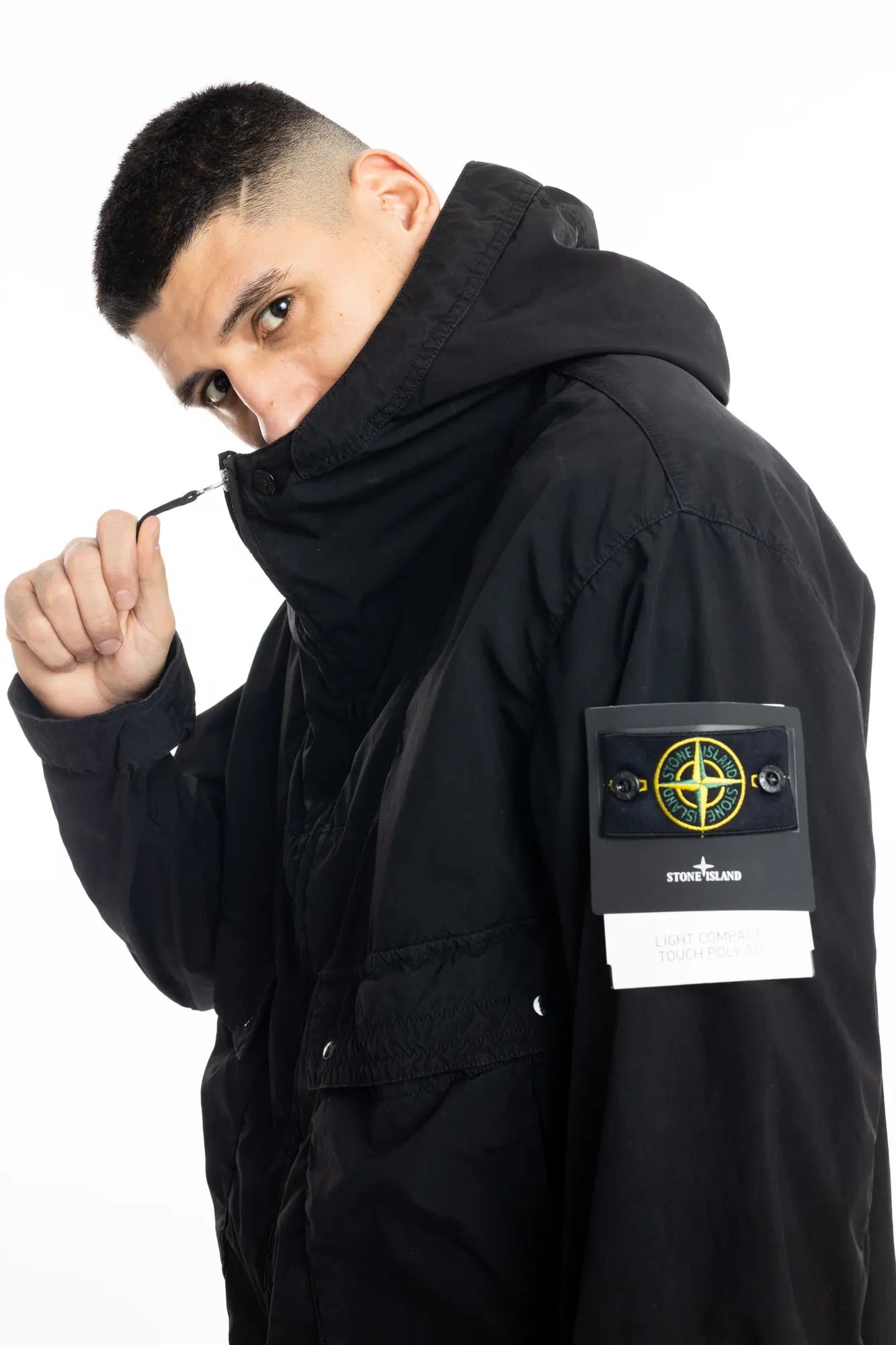 Stone Island, Mens Jacket, Black V0029, Hooded, Two-way zip, Compass Badge, Logo-patch, YKK Zippers, Bellows Pockets, Stone Island Snap Pockets, Adjustable Cuffs, Holding Zipper Close-up. 