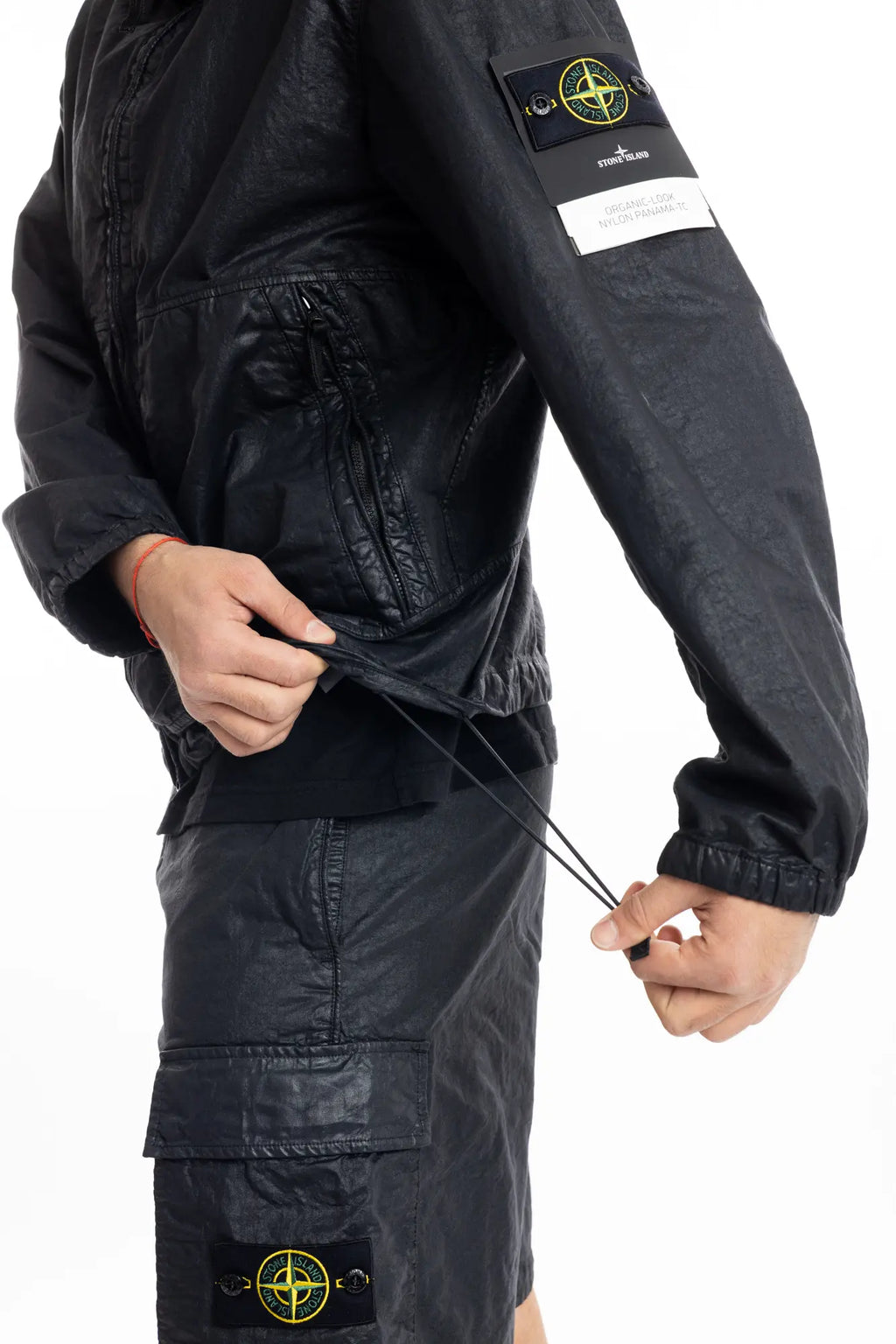 Stone Island, Mens Jacket, Black V0029, Hooded, Drawcord, Elasticated cuffs and hem, Full Zip, YKK Zippers, Compass Badge, Logo-patch, Side Pockets, Hem Drawcord Close-up. 