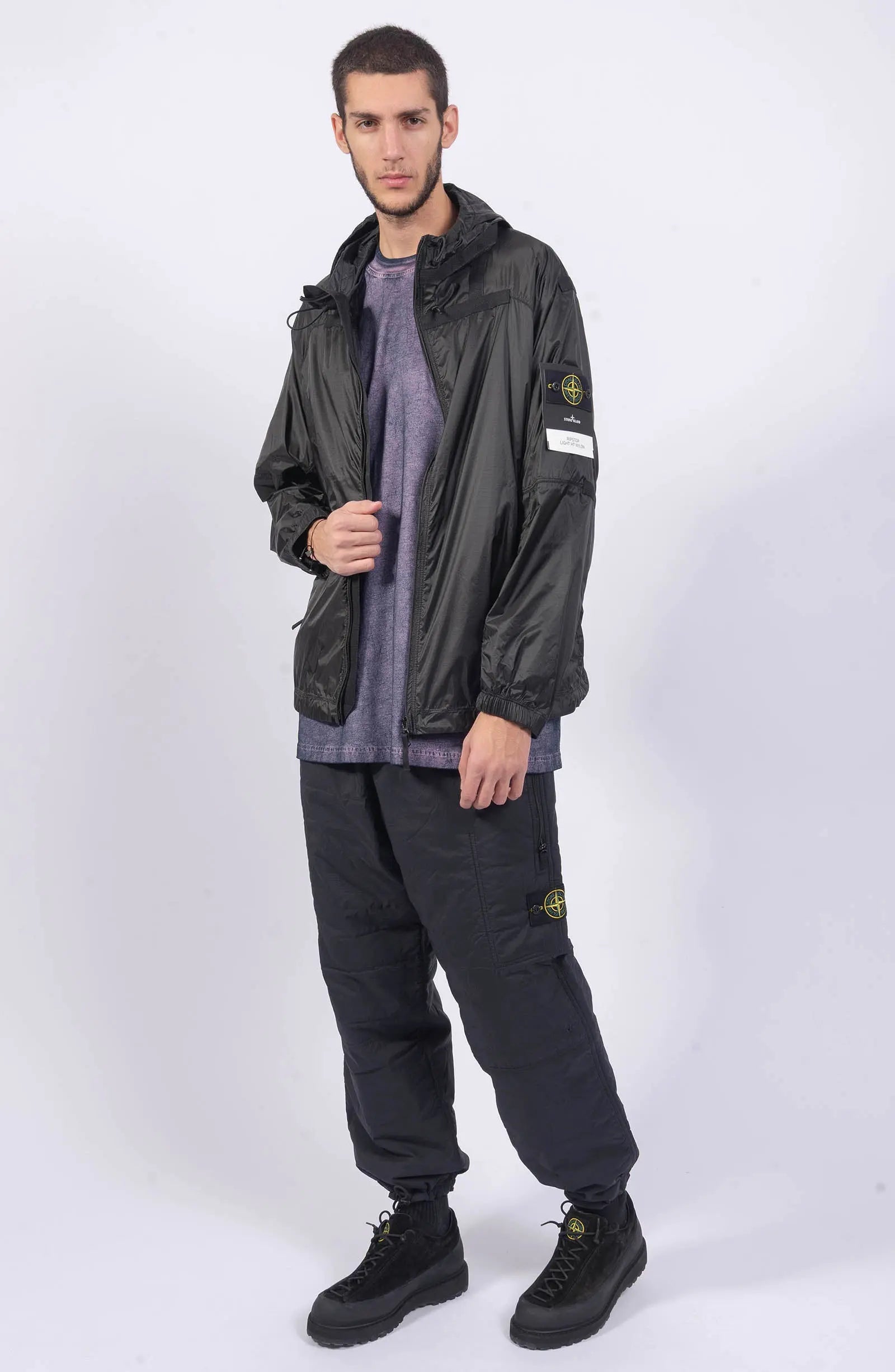 Stone Island, Mens Jacket, Windbreaker, Black V0029, Semi-Transparent, Elasticated Cuffs, Full Zip, YKK Zippers, Compass Badge, Logo-Patch, Side Pockets, Hooded, Full Body Photo. 