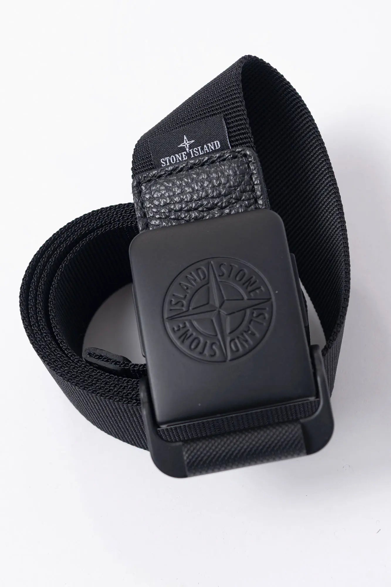 Stone Island, Mens Buckle, Black V0029, Matten Painted, Cowhide Details, Compass Logo, Top-Down View. 