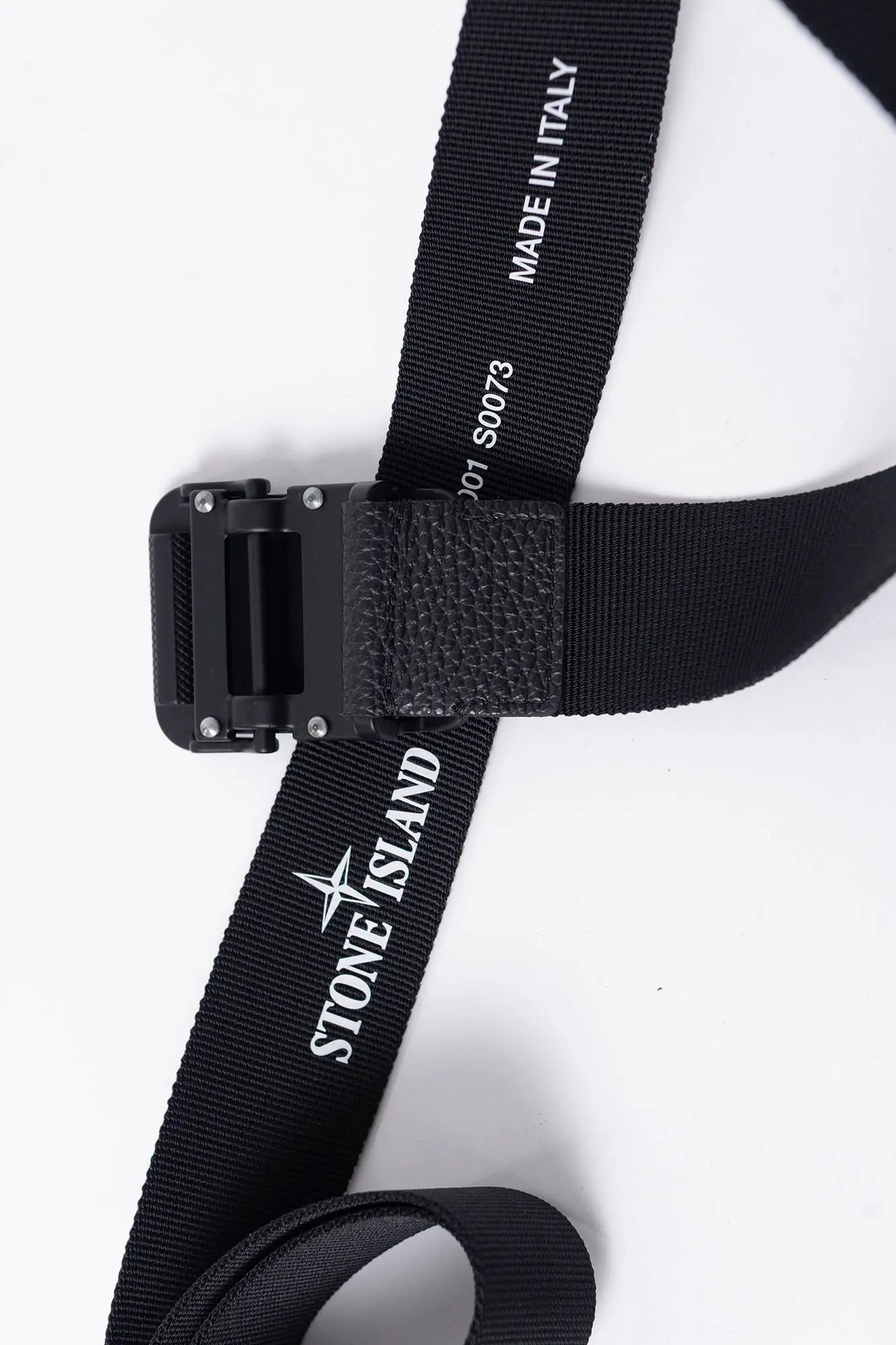 Stone Island, Mens Buckle, Black V0029, Matten Painted, Cowhide Details, Compass Logo, Buckle Showcase Top-Down View.