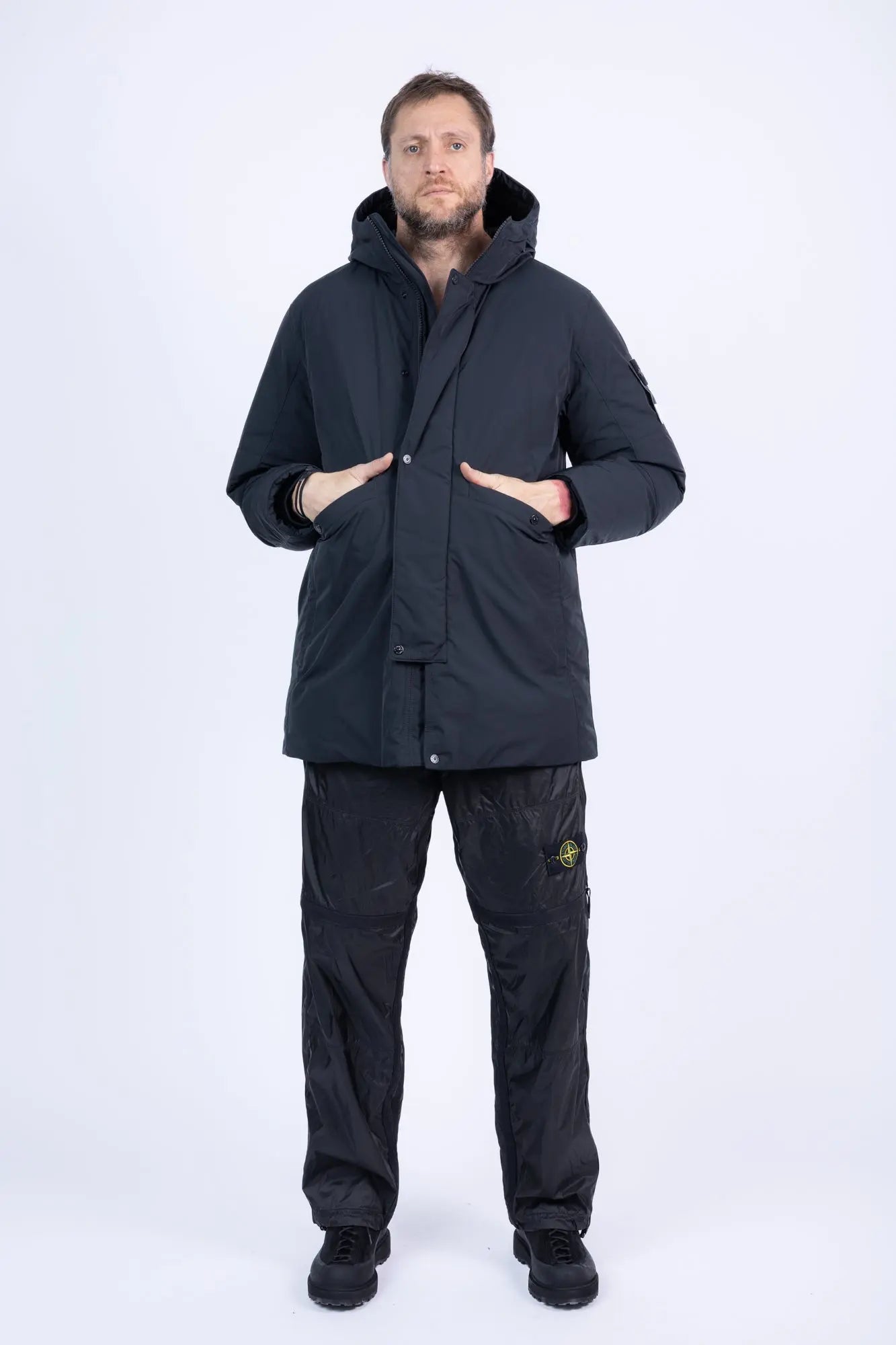 Stone Island, Mens Jacket, Black V0029, Long, Full Zip, YKK Zippers, Hooded, Stone Island Buttons, Compass Badge, Logo-patch, Любо Чука, Full Body View Hands in Pockets. 