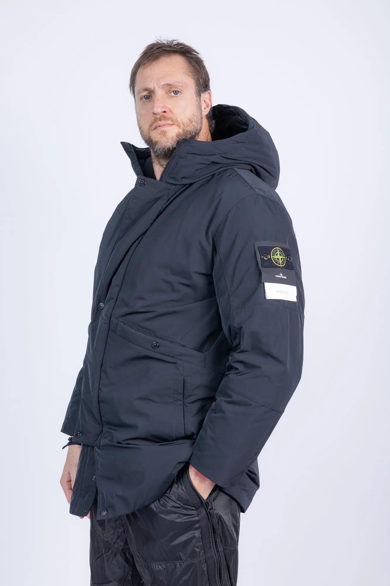 Stone Island, Mens Jacket, Black V0029, Long, Full Zip, YKK Zippers, Hooded, Stone Island Buttons, Compass Badge, Logo-patch, Любо Чука, 3/4 View Hand in Pocket. 