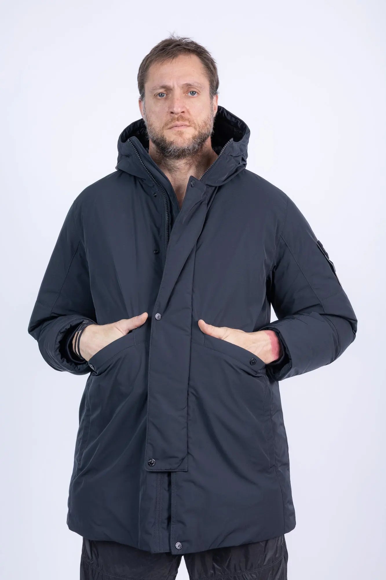 Stone Island, Mens Jacket, Black V0029, Long, Full Zip, YKK Zippers, Hooded, Stone Island Buttons, Compass Badge, Logo-patch, Любо Чука, Front Portrait Hands in Pockets. 
