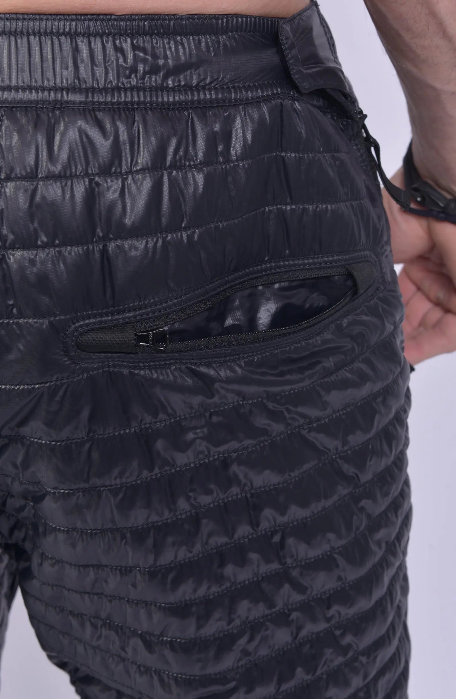 Stone Island, Mens Trousers, Black, Quilted, PrimaLoft Insulated, Stone Island Badge, Compass Badge, Elasticated Waistband, Elasticated Ankles, Side Pockets, YKK Zipper, Back Pocket Close-up. 